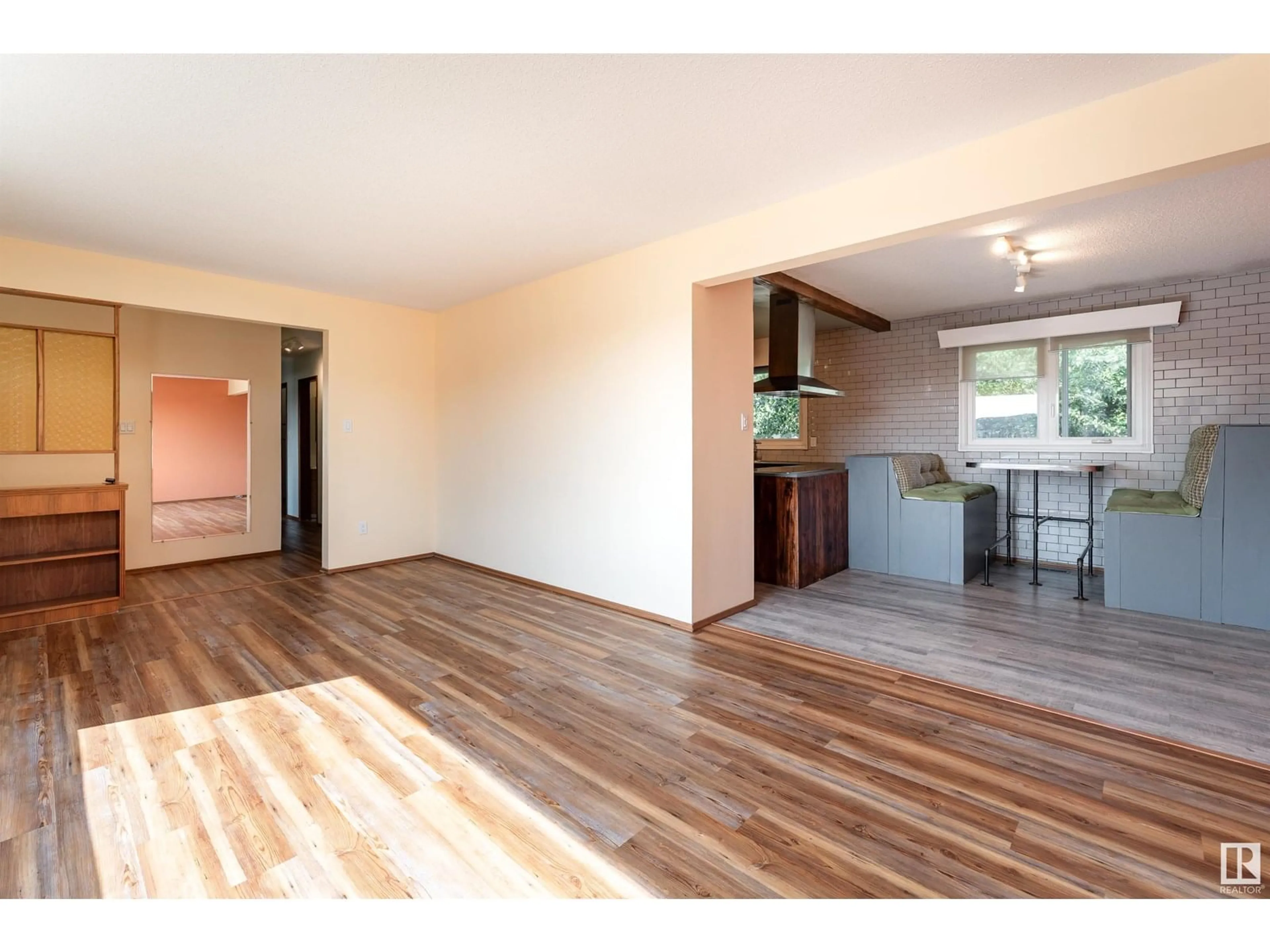 Open concept kitchen, wood/laminate floor for 10404 34 ST, Edmonton Alberta T5W1X9