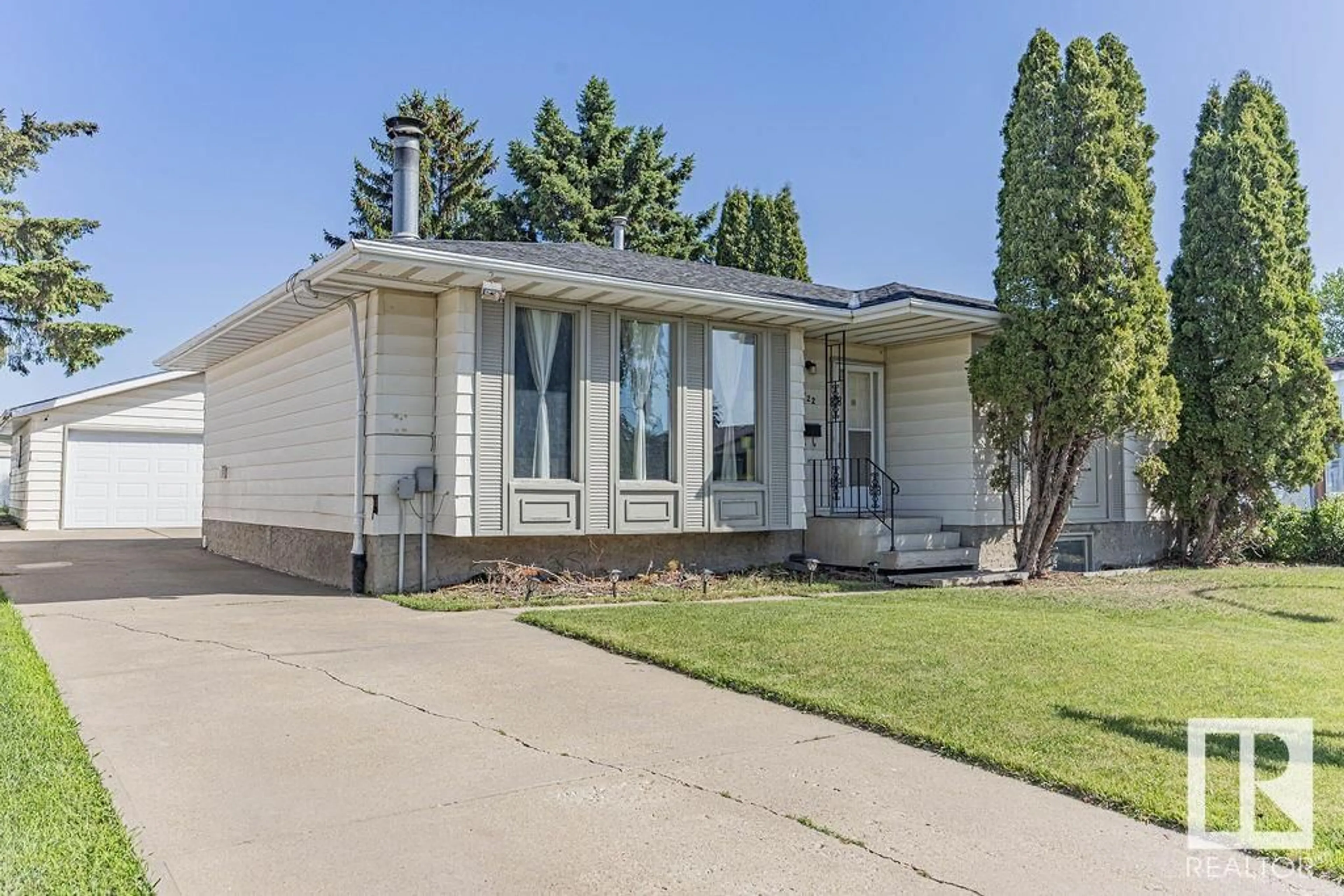 Home with vinyl exterior material, street for NW - 4122 134A AV, Edmonton Alberta T5A2N5