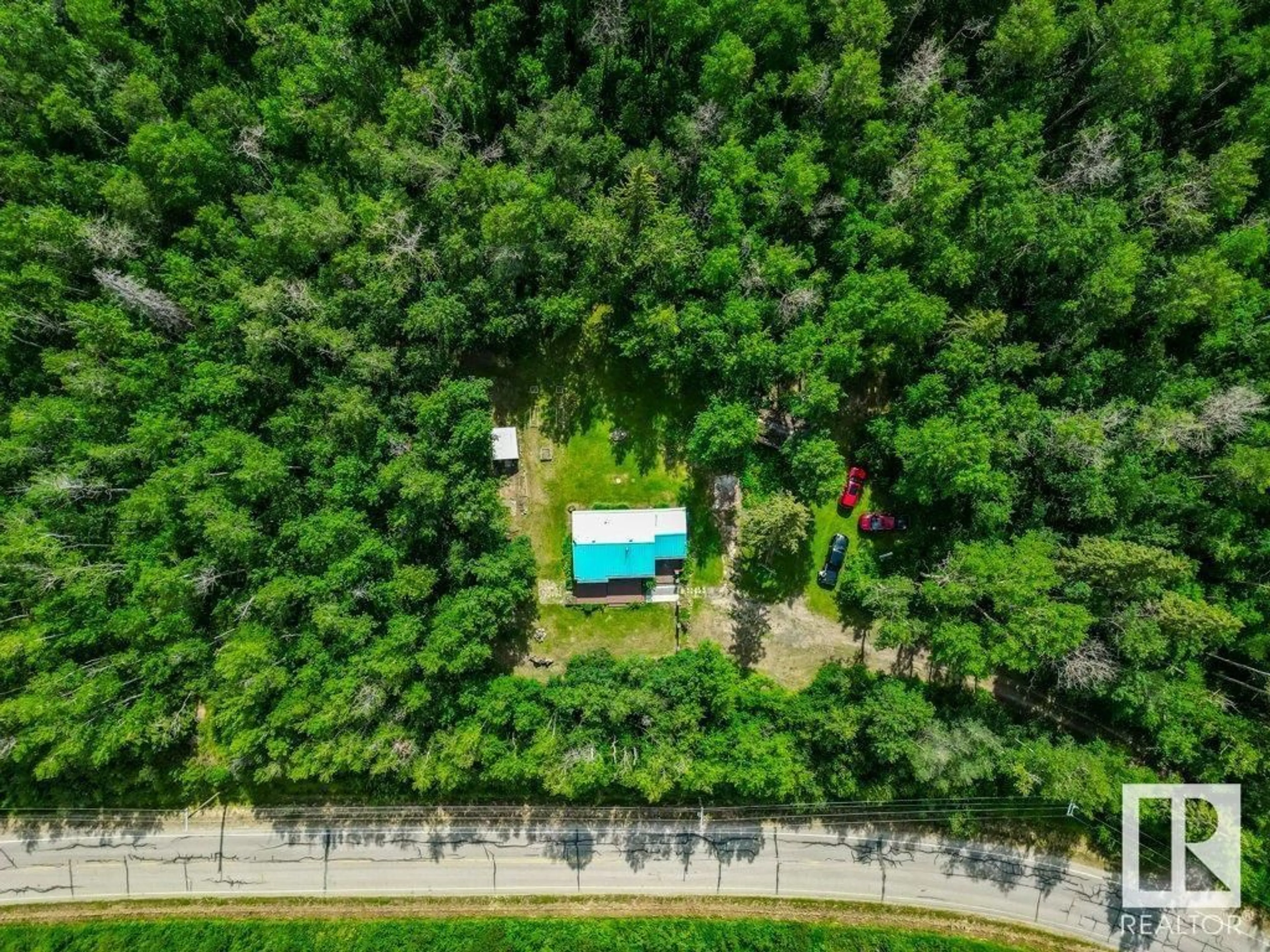A pic from outside/outdoor area/front of a property/back of a property/a pic from drone, forest/trees view for 54503 STE. ANNE TR, Rural Lac Ste. Anne County Alberta T0E1A1
