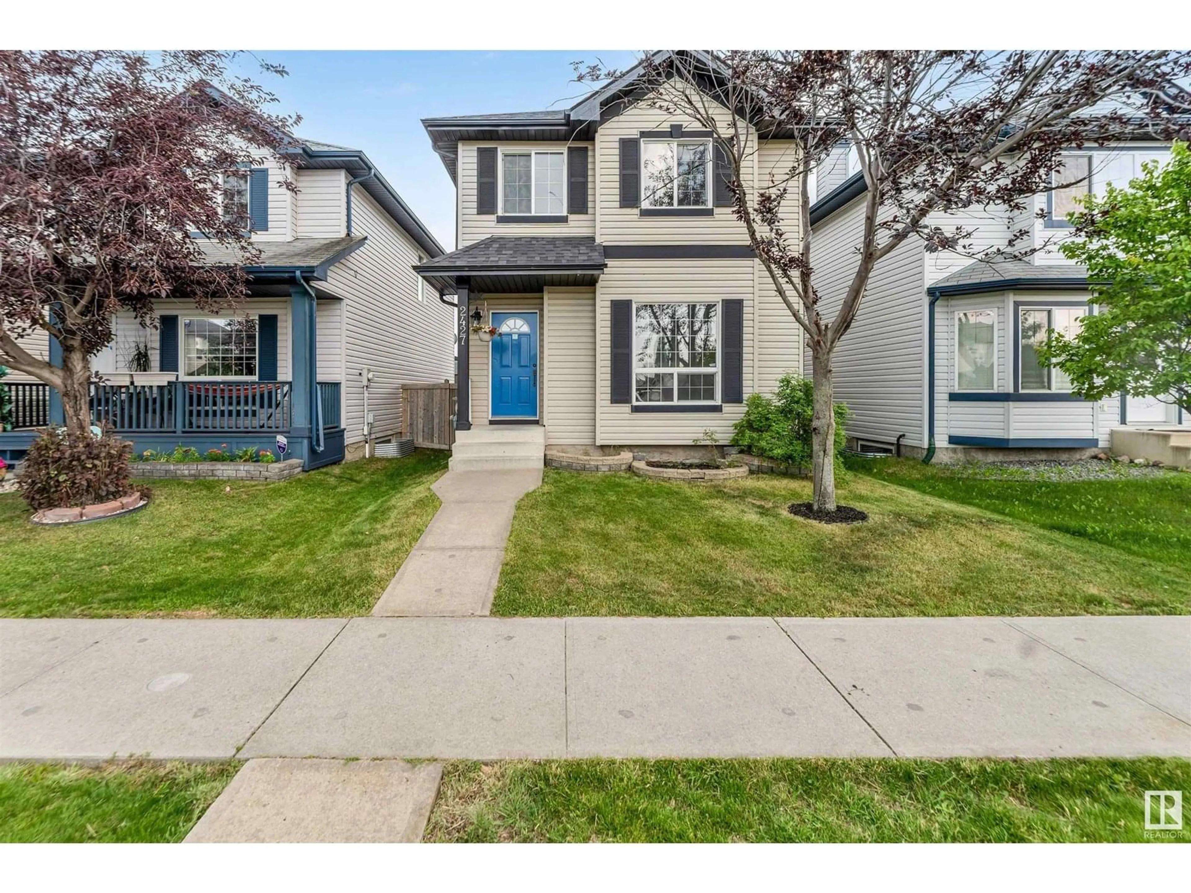 Home with vinyl exterior material, street for NW - 2427 28B AV, Edmonton Alberta T6T2A3
