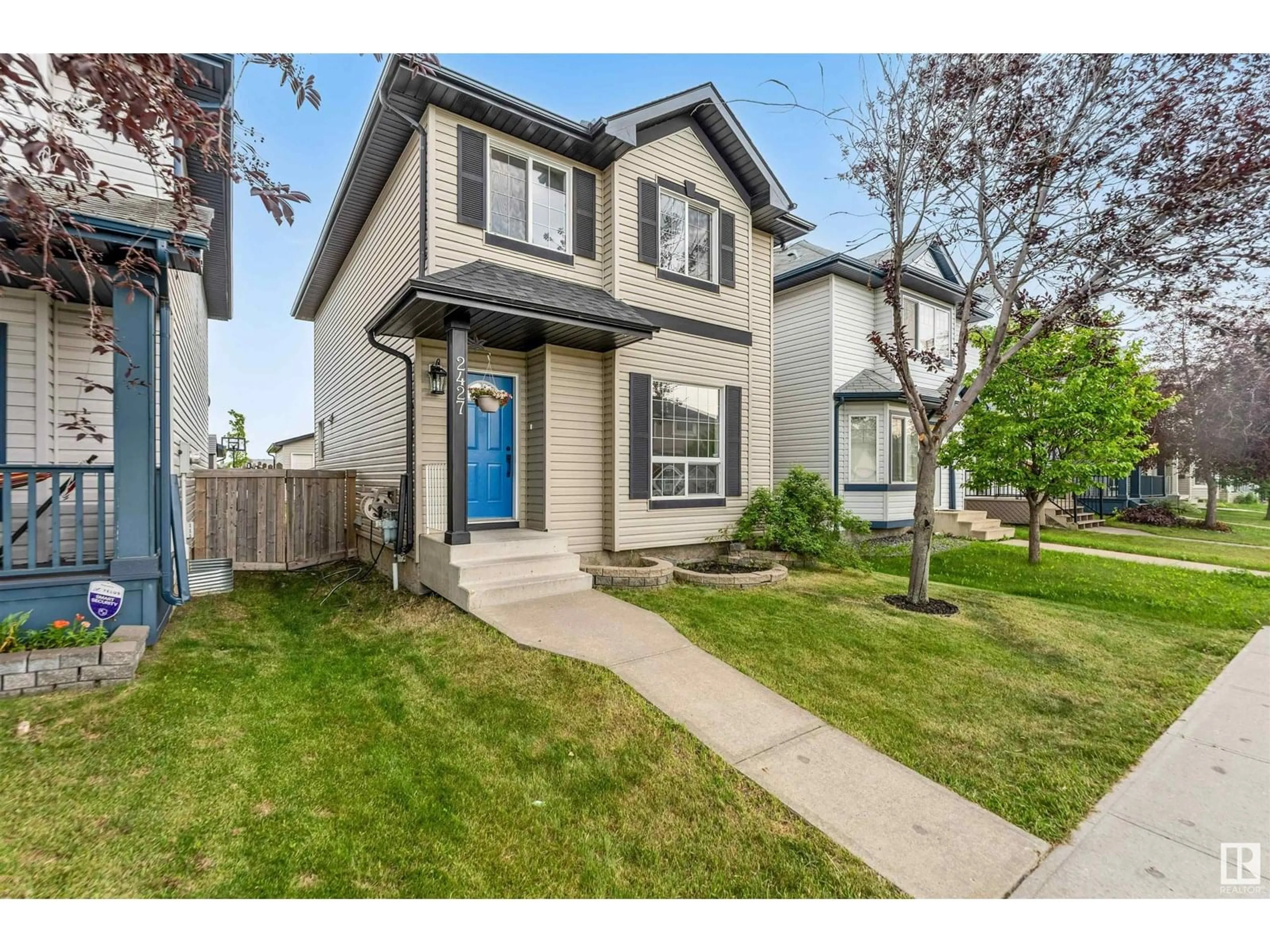 Home with vinyl exterior material, street for NW - 2427 28B AV, Edmonton Alberta T6T2A3