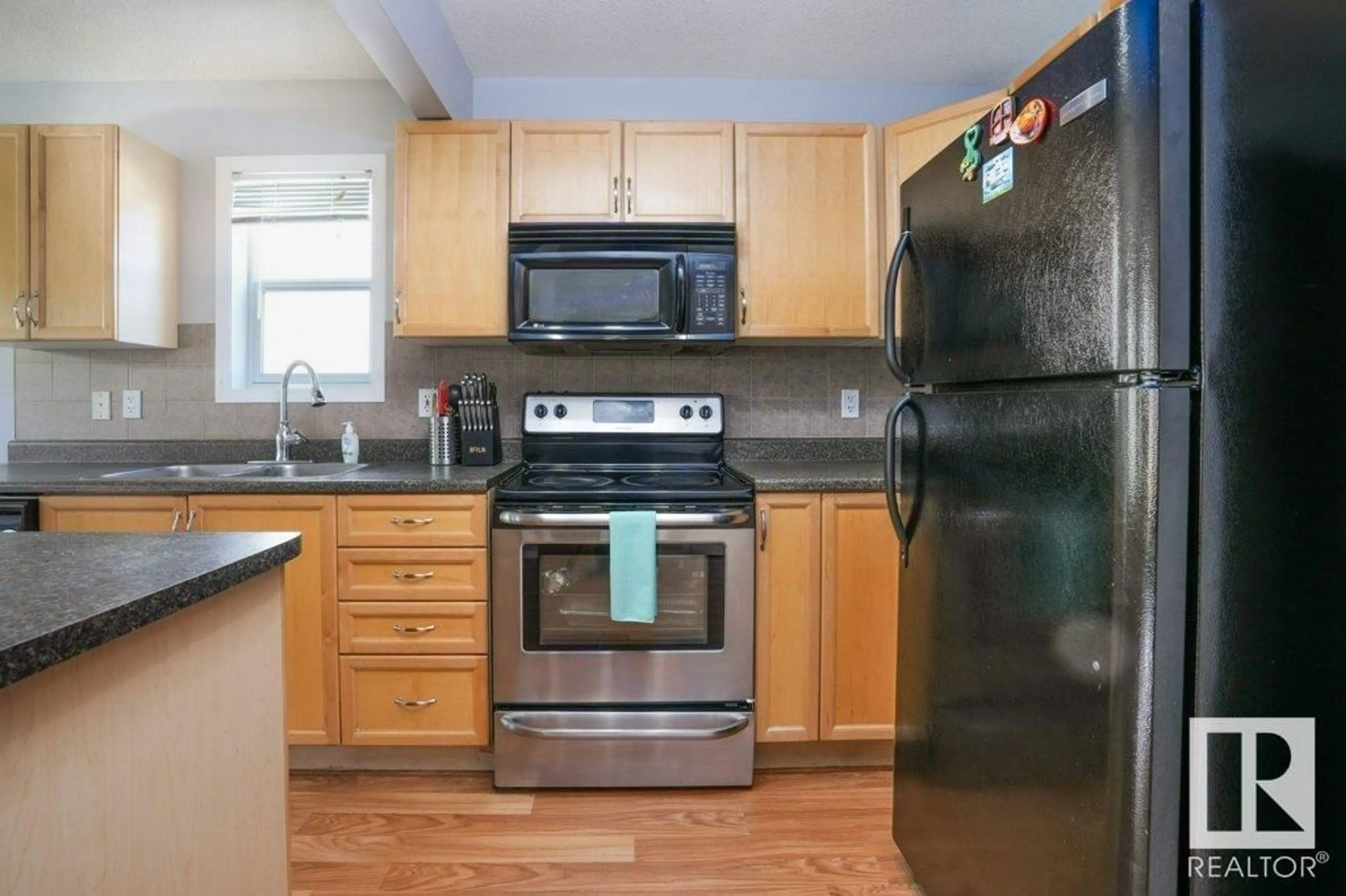 Standard kitchen, wood/laminate floor for 2134 HAMMOND CO NW, Edmonton Alberta T6M0J1