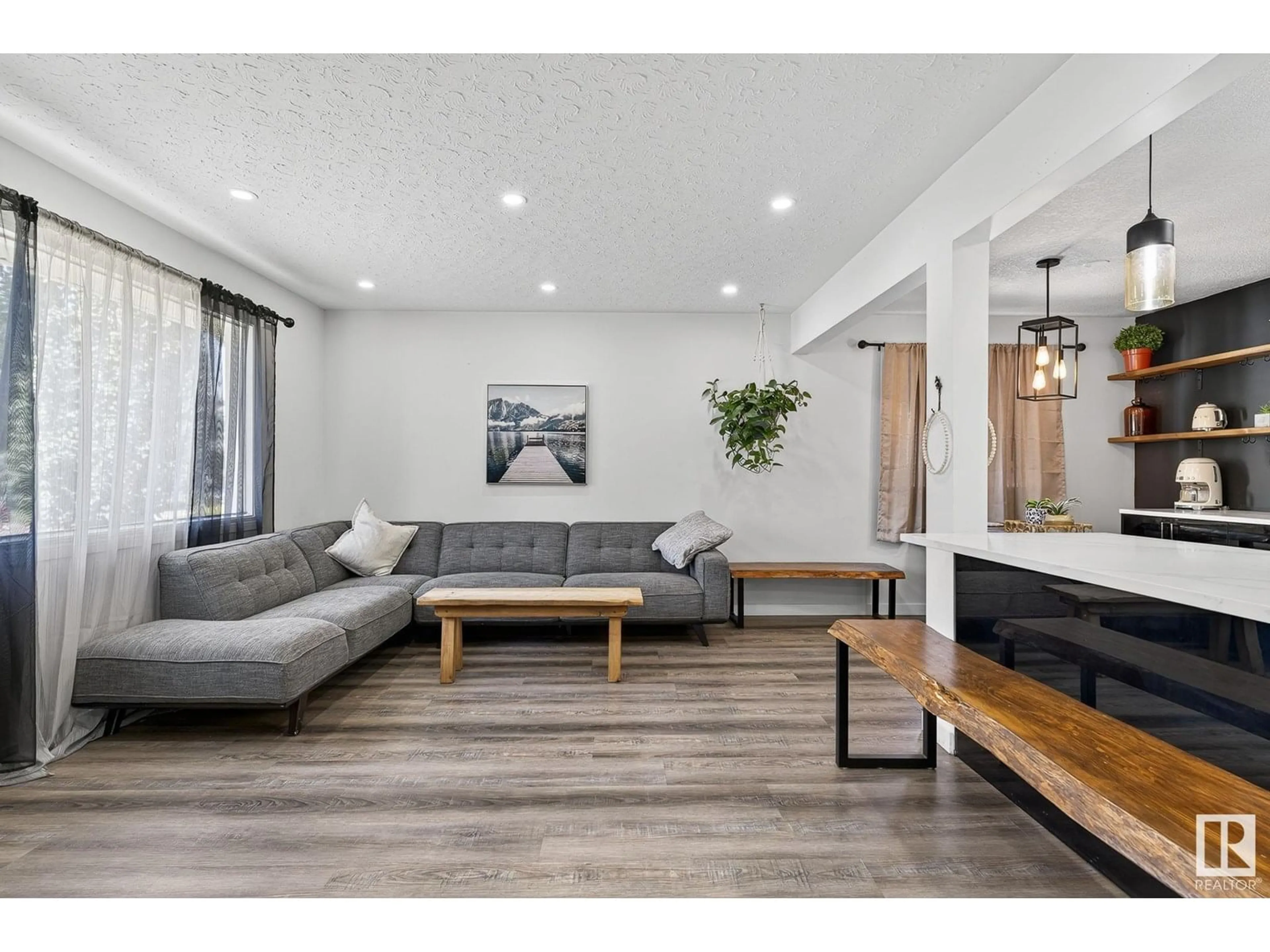 Living room with furniture, wood/laminate floor for 5216 97A AV, Edmonton Alberta T6B1E1
