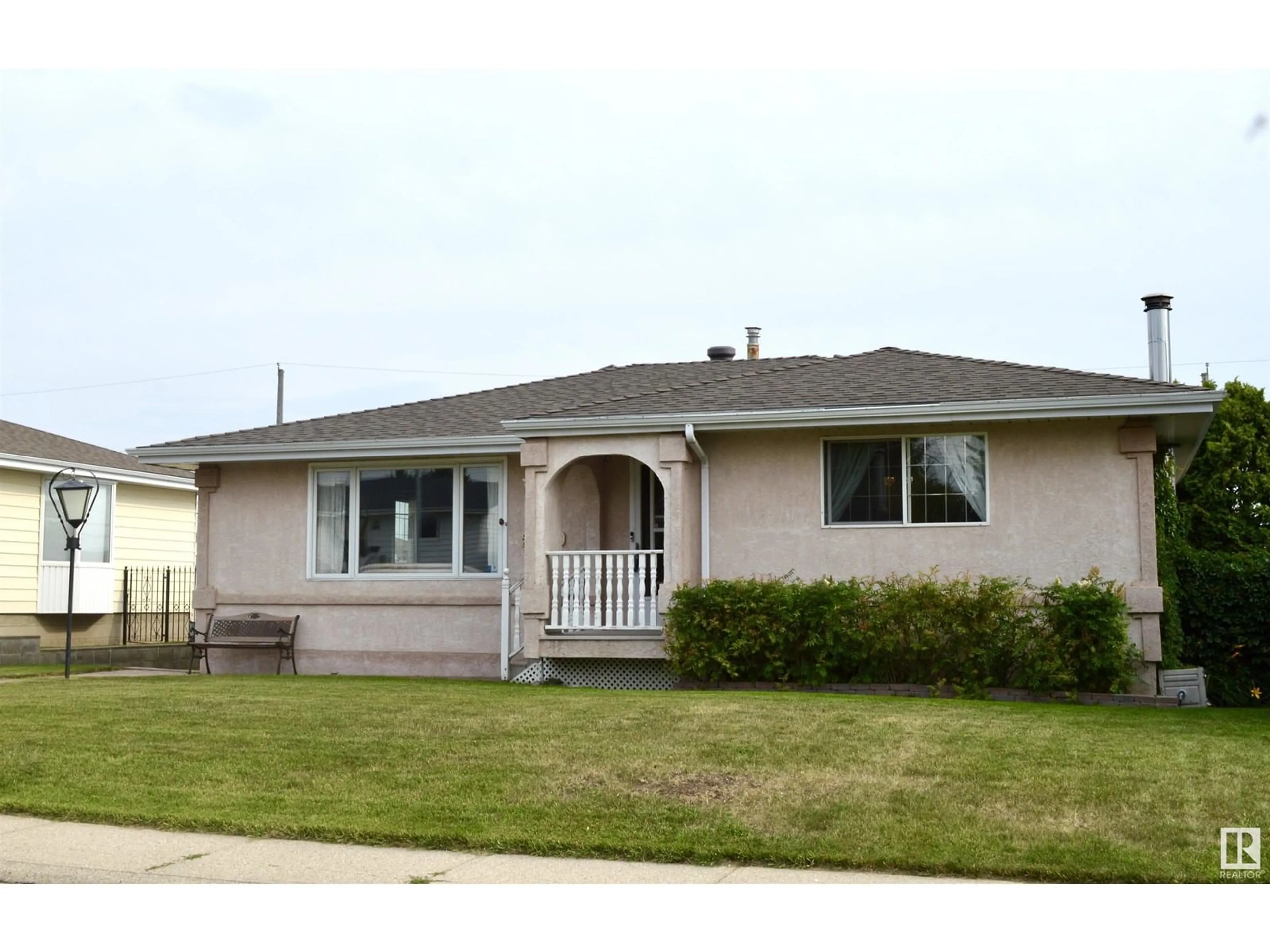 Home with vinyl exterior material, street for 5619 140A AV, Edmonton Alberta T5A1H4
