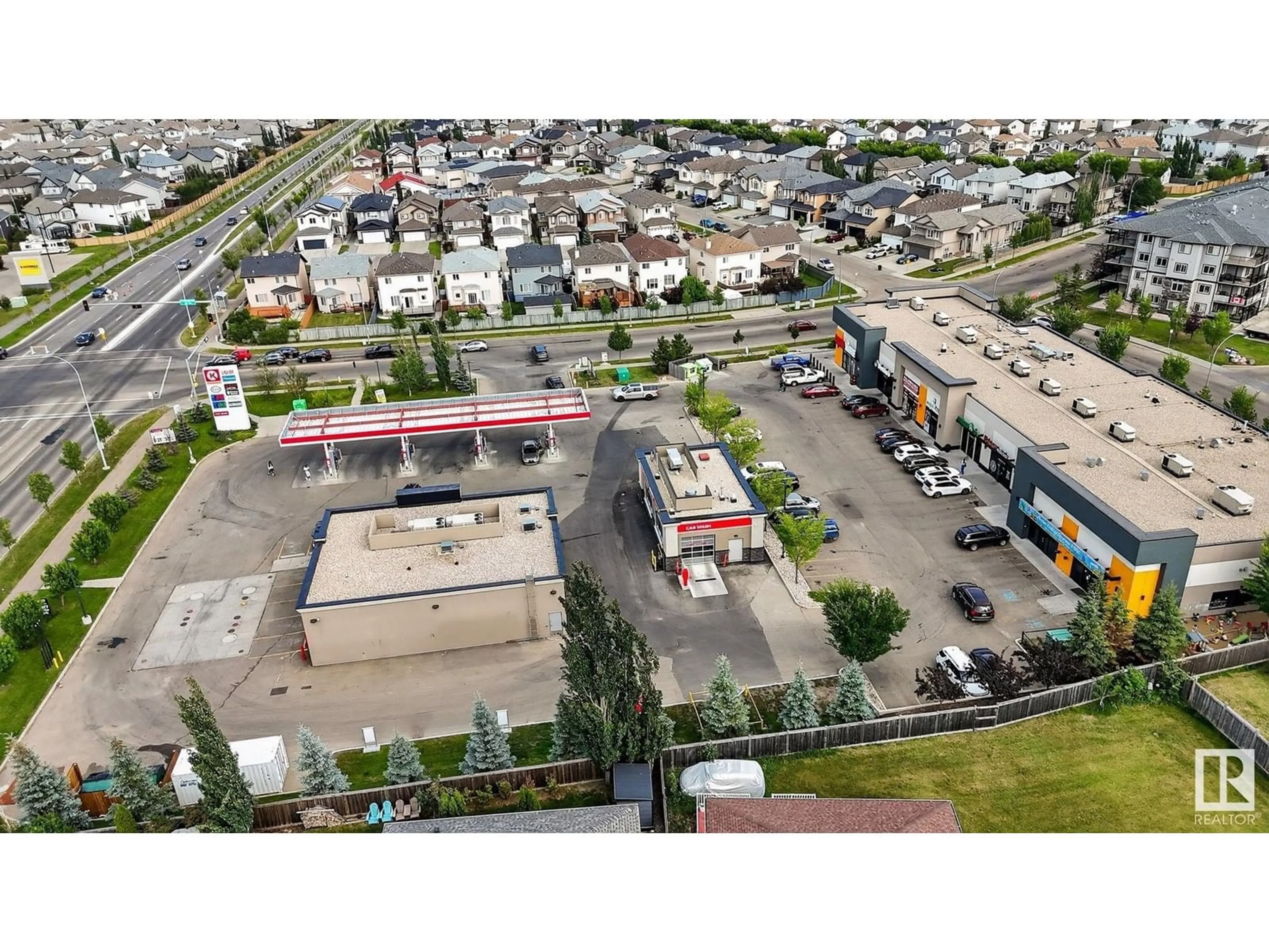 A pic from outside/outdoor area/front of a property/back of a property/a pic from drone, street for NW - 6040 165 AV, Edmonton Alberta T5Y0A9