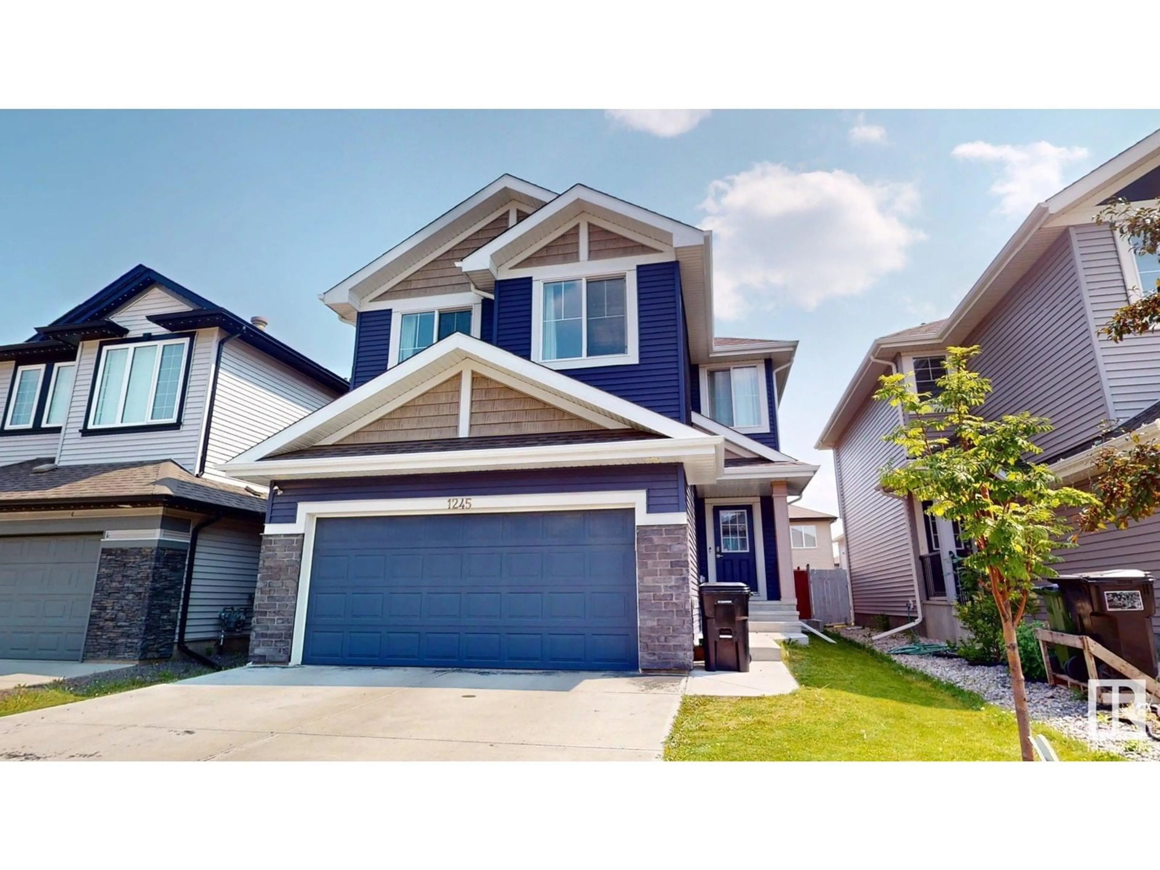 Home with vinyl exterior material, street for NW - 1245 26A ST, Edmonton Alberta T6T2J4