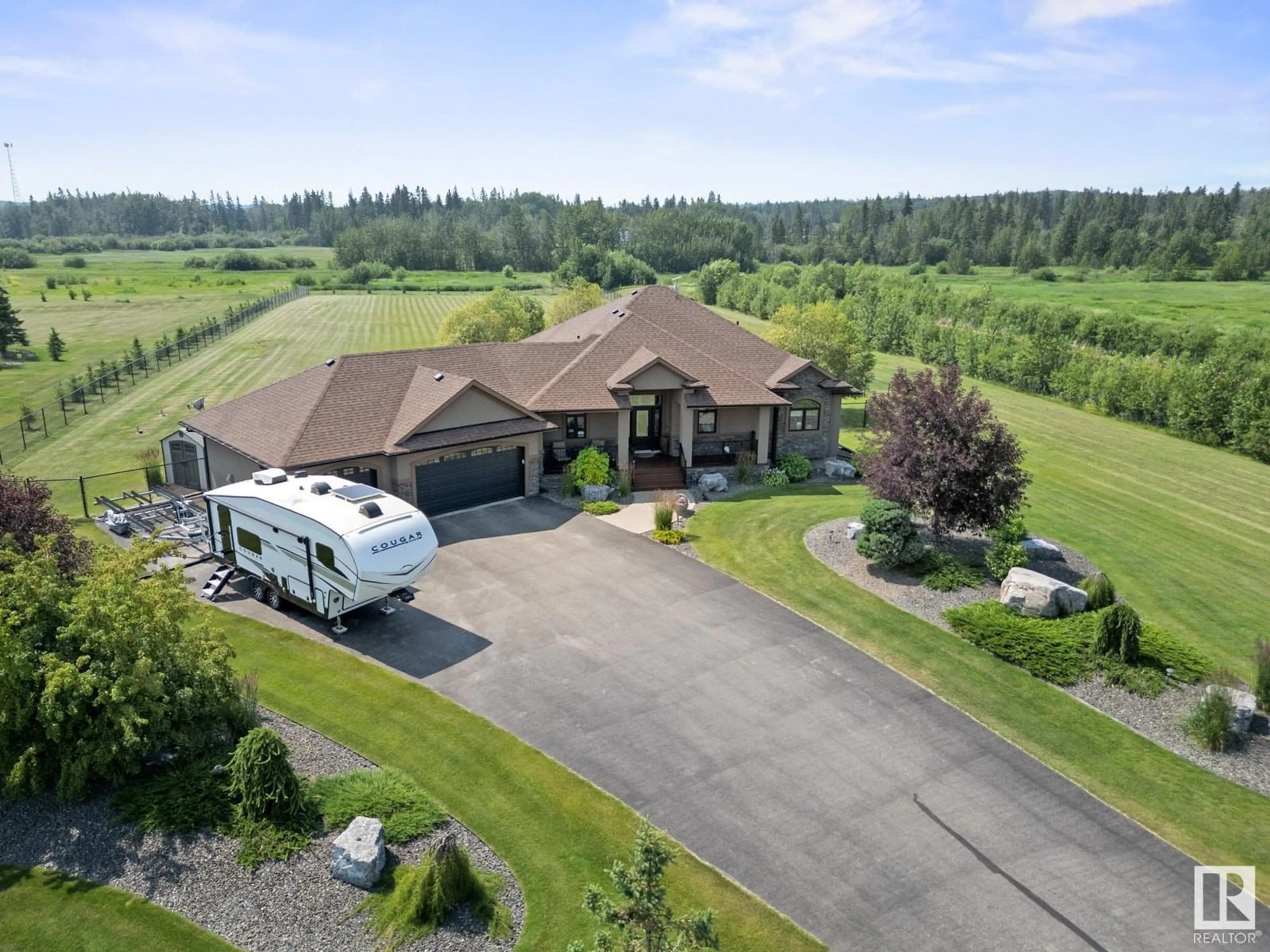 A pic from outside/outdoor area/front of a property/back of a property/a pic from drone, unknown for #8 - 27320 TWP ROAD 534, Rural Parkland County Alberta T7X3R9