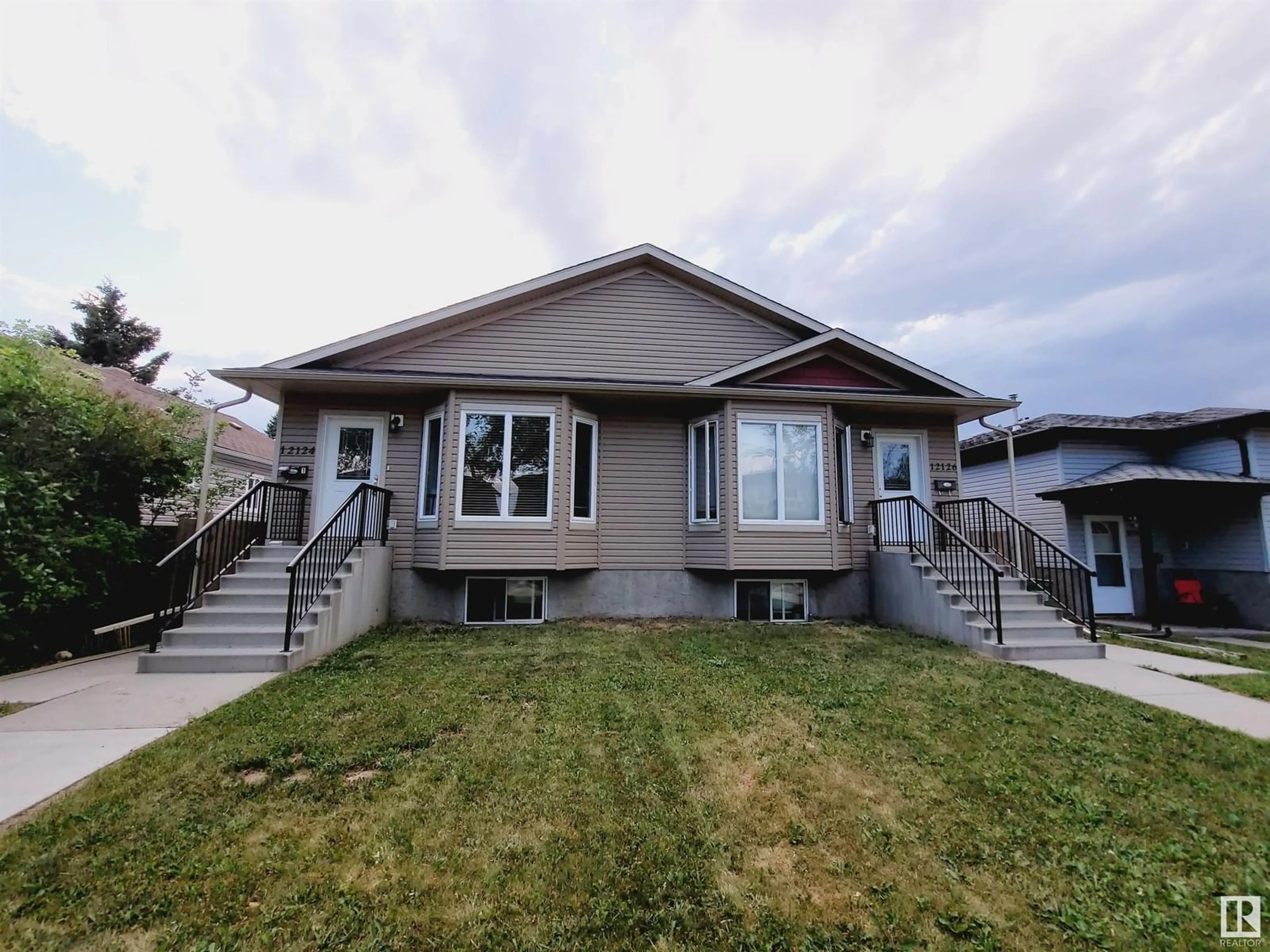 Home with vinyl exterior material, street for NW - 12124 122 ST, Edmonton Alberta T5L0C8