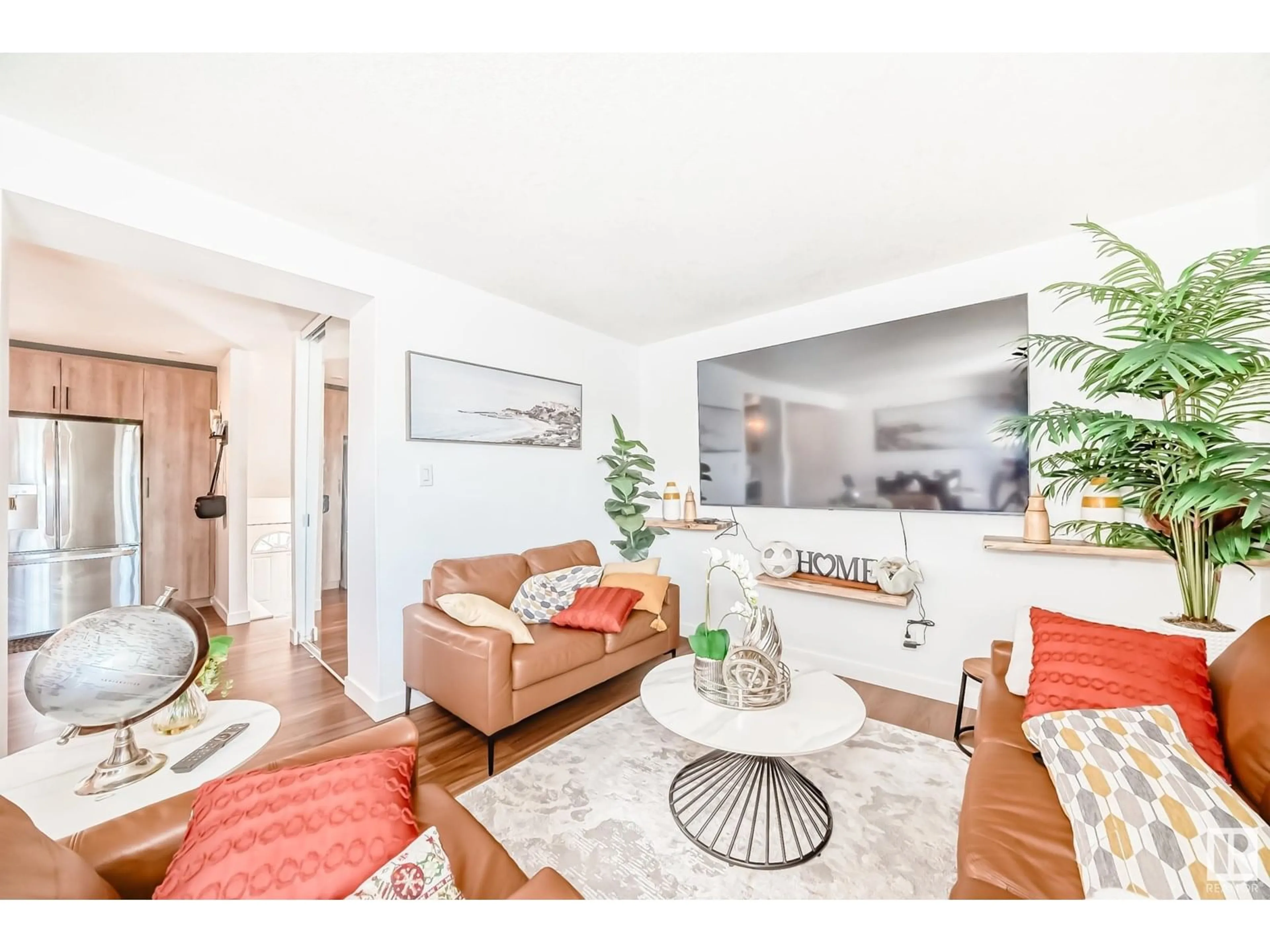 Living room with furniture, wood/laminate floor for 5507 144A AV, Edmonton Alberta T5A3R2