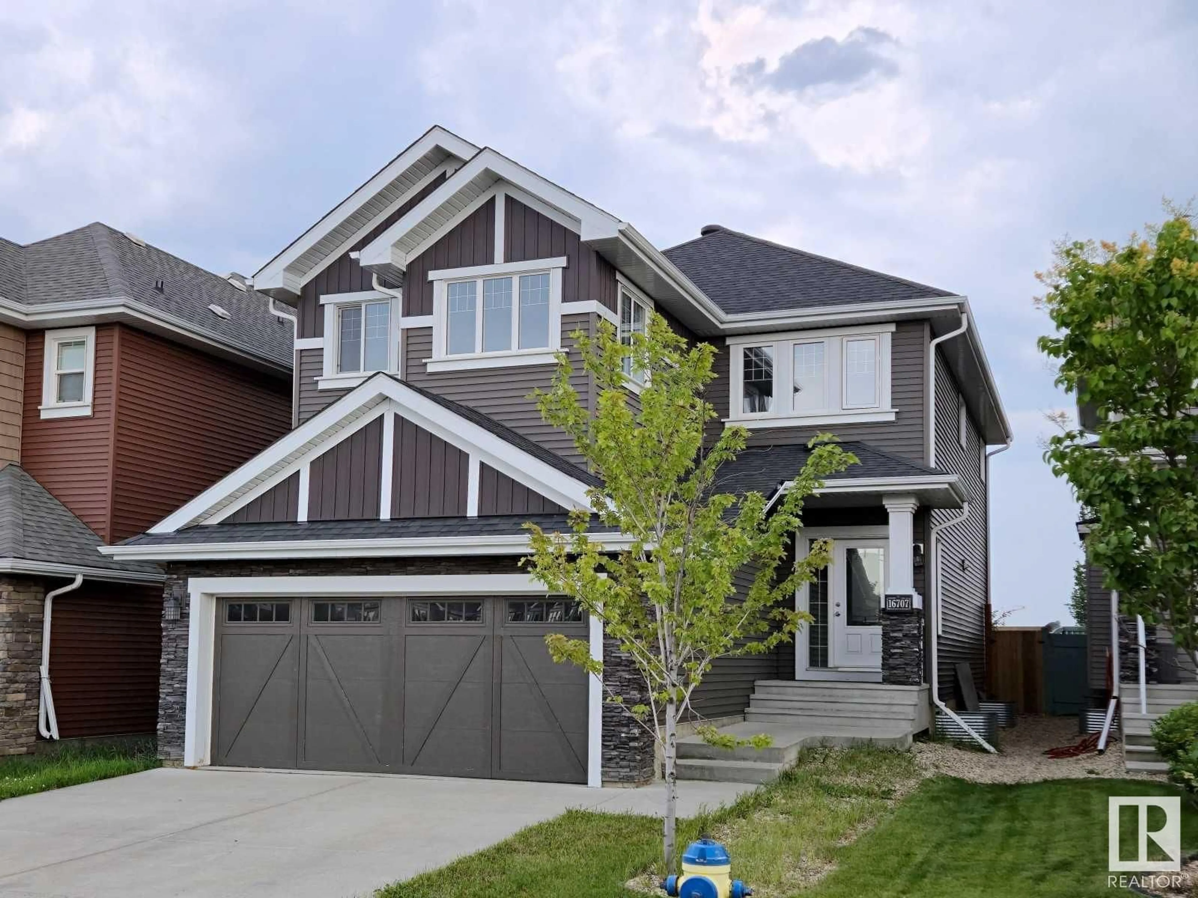 Home with vinyl exterior material, street for 16707 18 AV, Edmonton Alberta T6W3C5