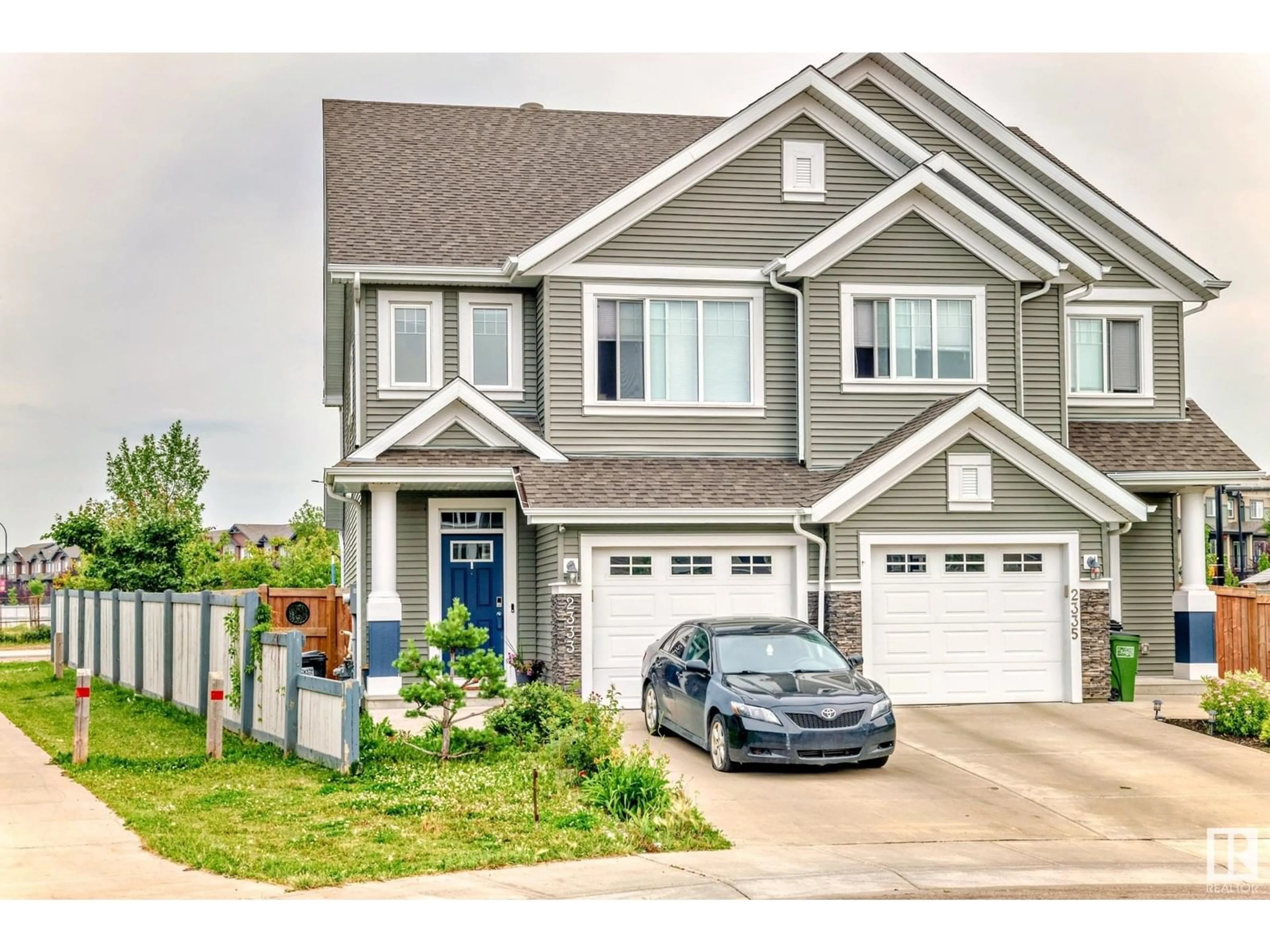 Home with vinyl exterior material, street for 2333 82 ST, Edmonton Alberta T6X2J7