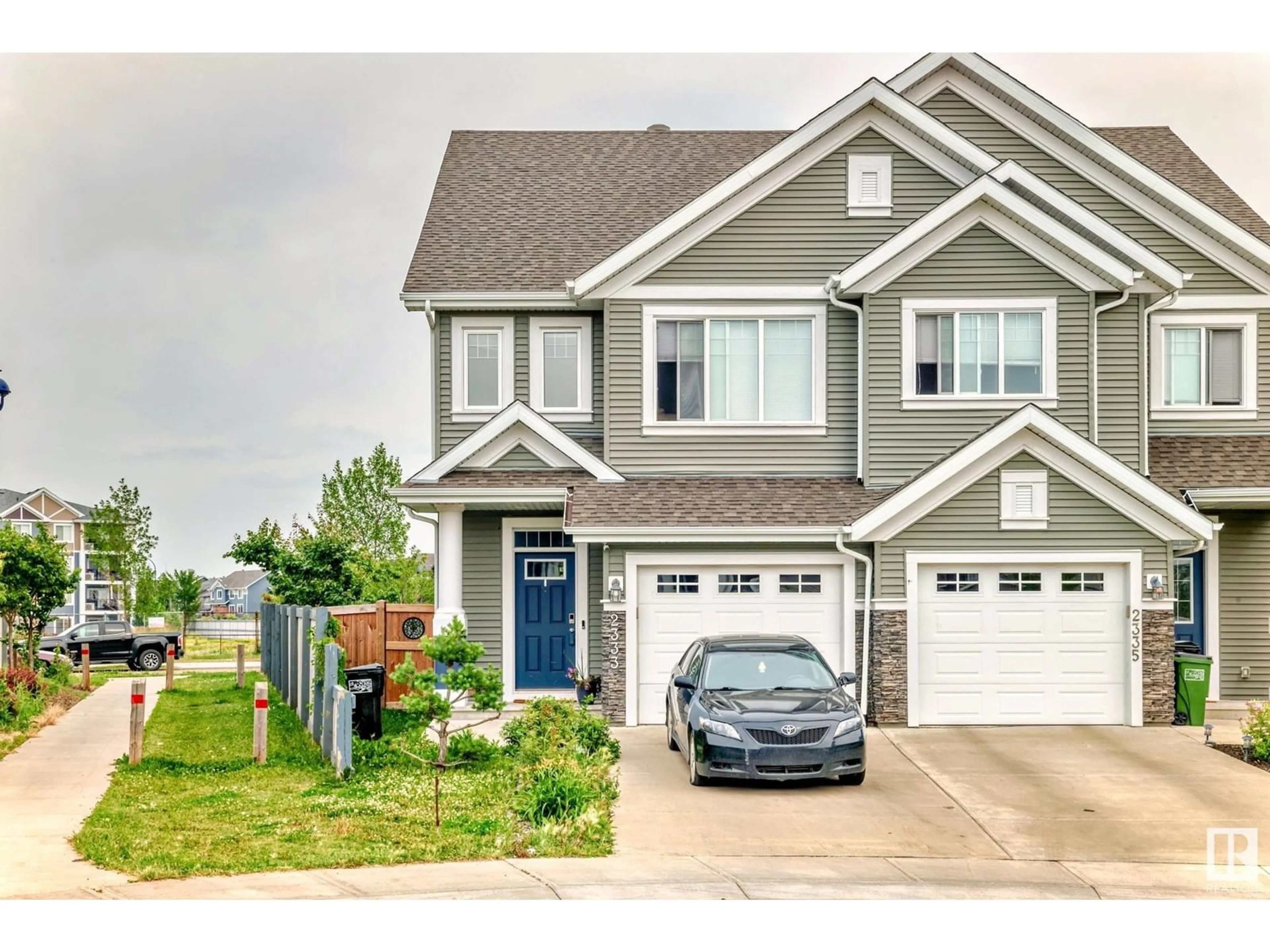 Home with vinyl exterior material, street for 2333 82 ST, Edmonton Alberta T6X2J7