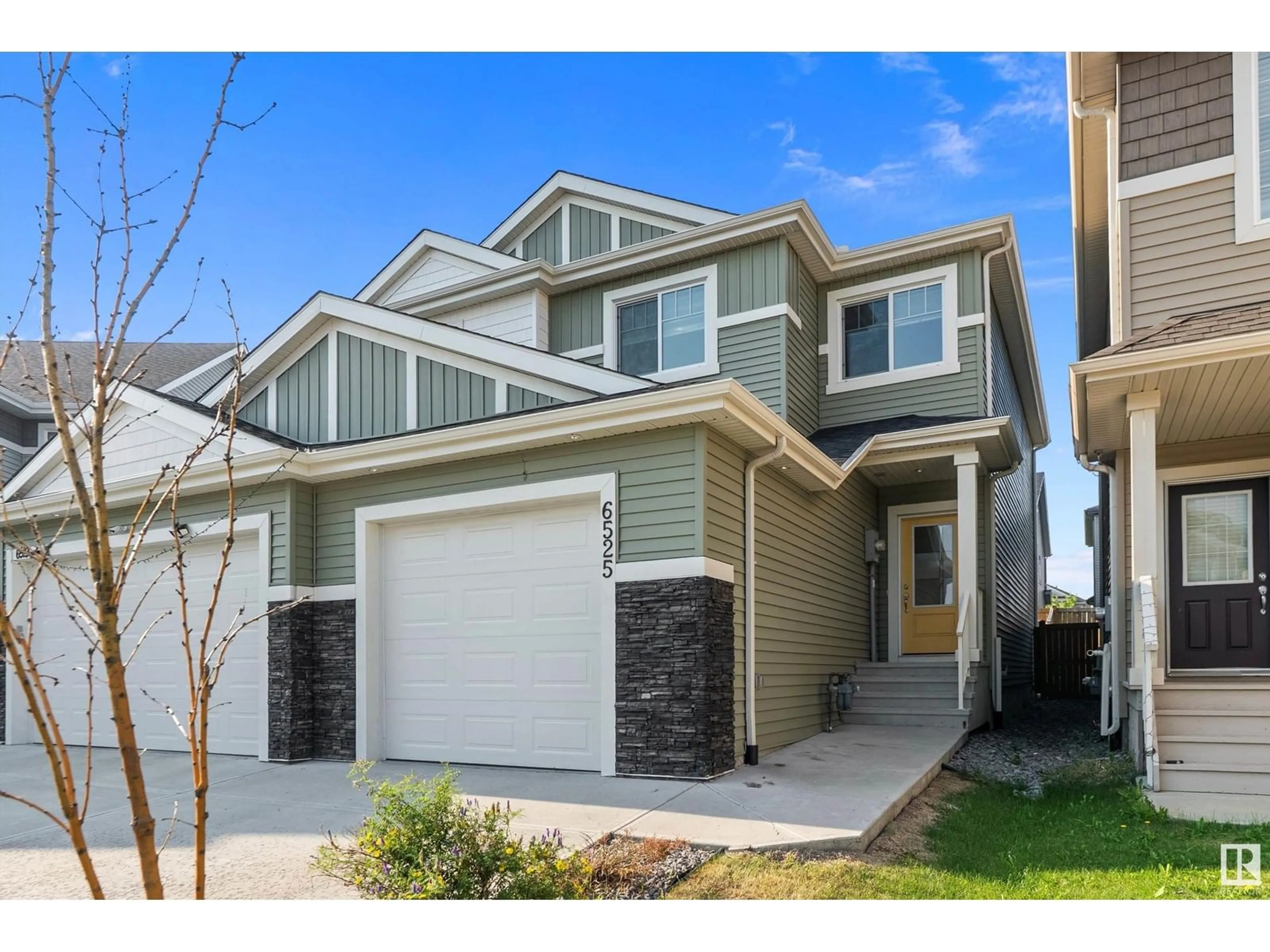 Home with vinyl exterior material, street for NW - 6525 167B AV, Edmonton Alberta T5Y3X8