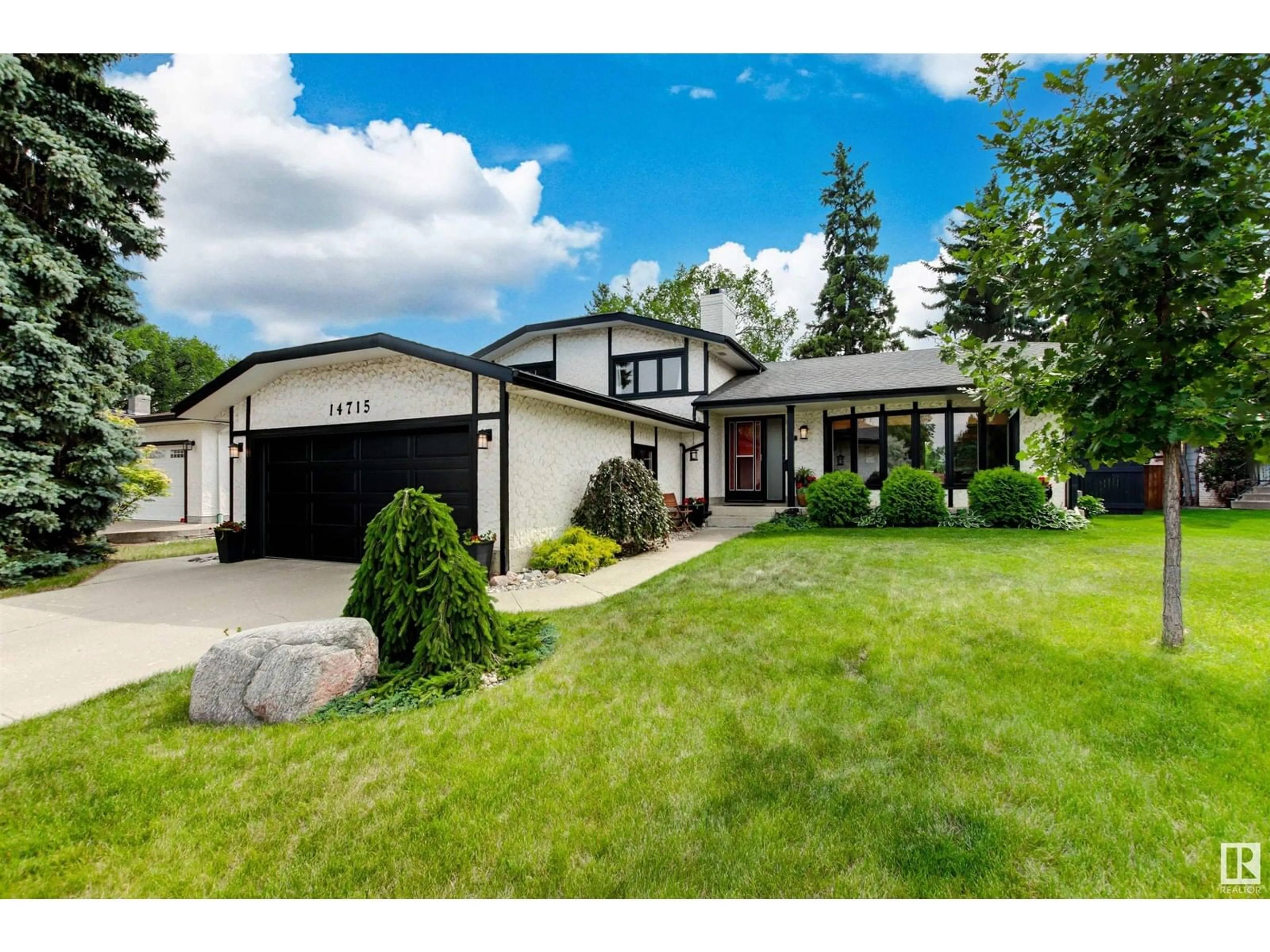 Home with vinyl exterior material, street for 14715 58 AV NW, Edmonton Alberta T6H4T3