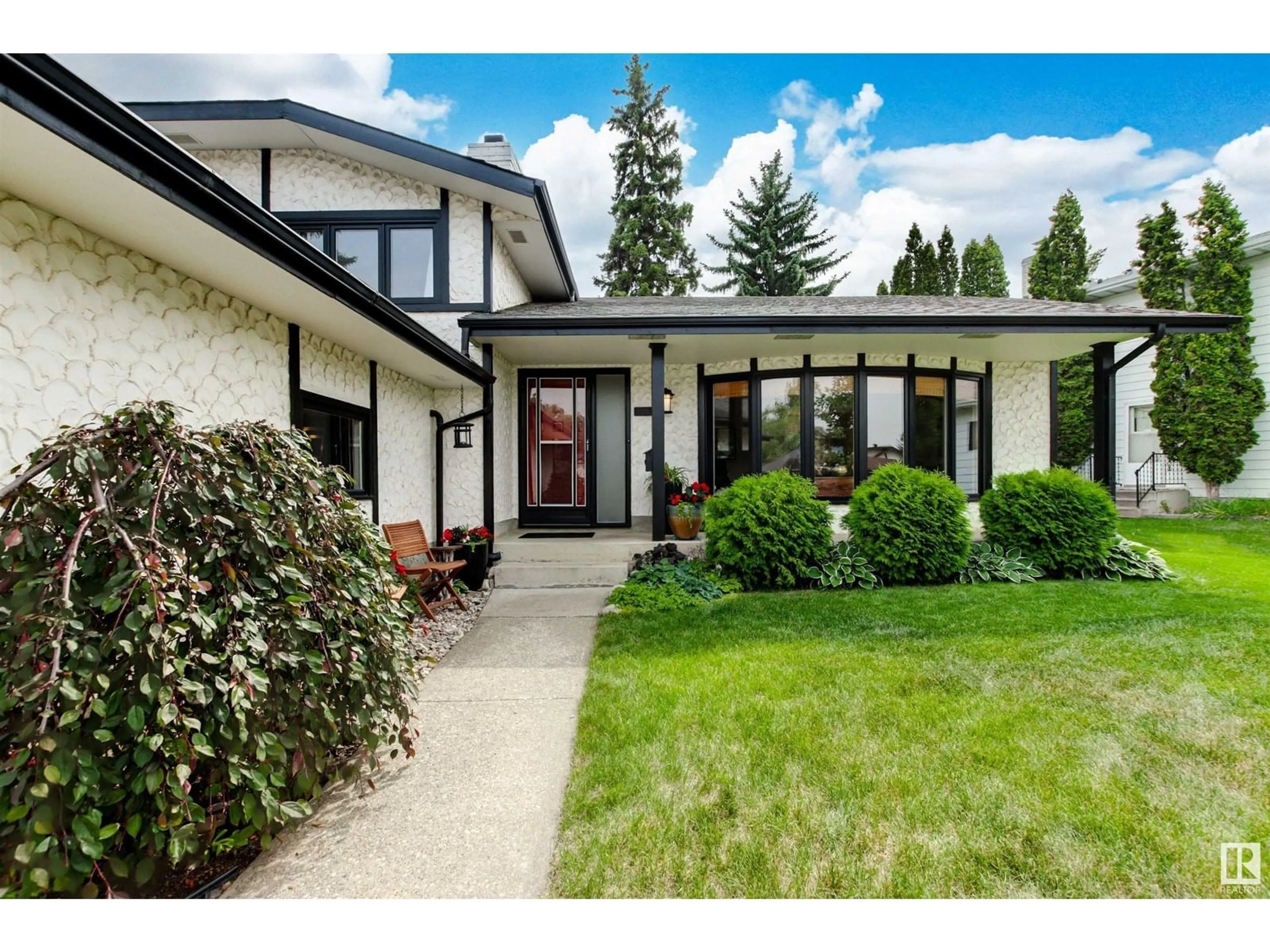 Home with vinyl exterior material, street for 14715 58 AV NW, Edmonton Alberta T6H4T3