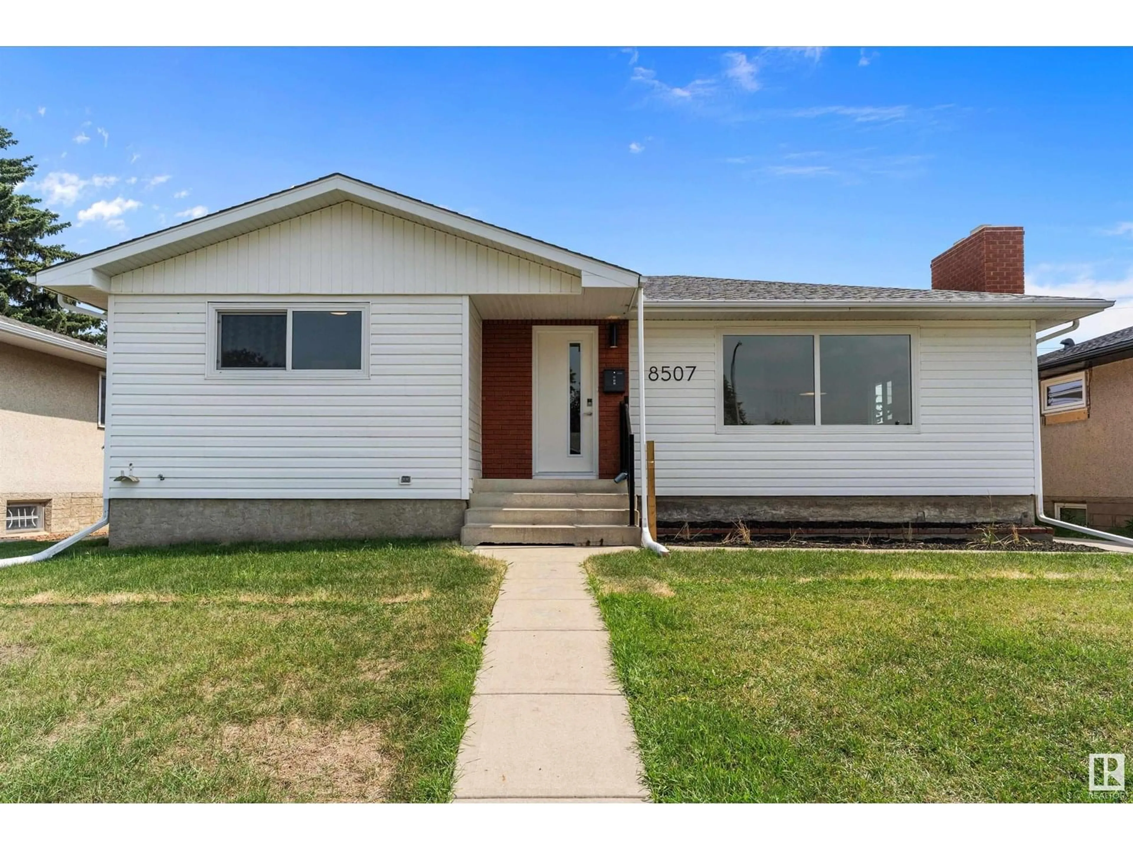 Home with vinyl exterior material, street for 8507 54 ST, Edmonton Alberta T6B1H2