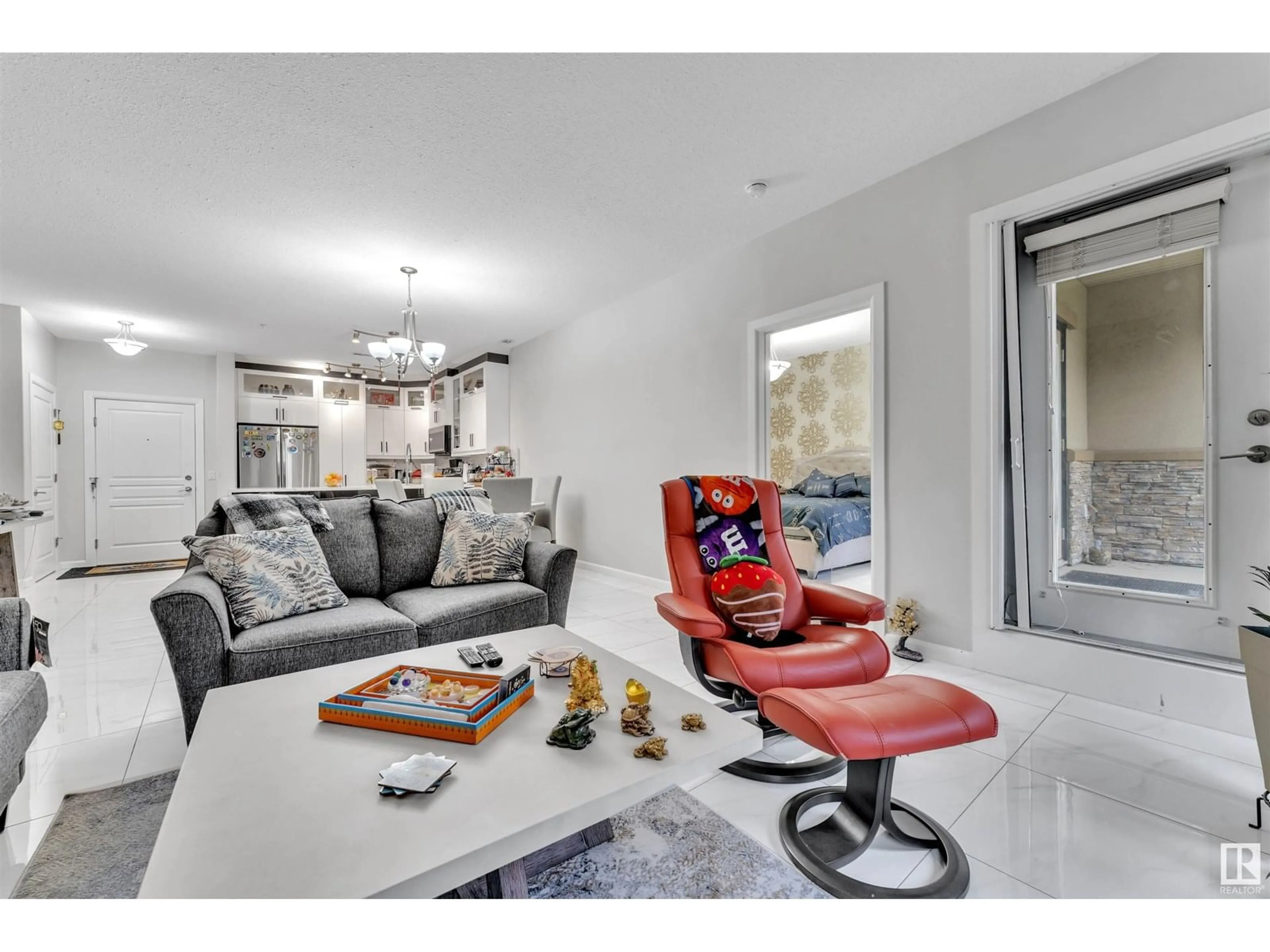 Living room with furniture, ceramic/tile floor for #105 - 160 MAGRATH ROAD, Edmonton Alberta T6R3T7