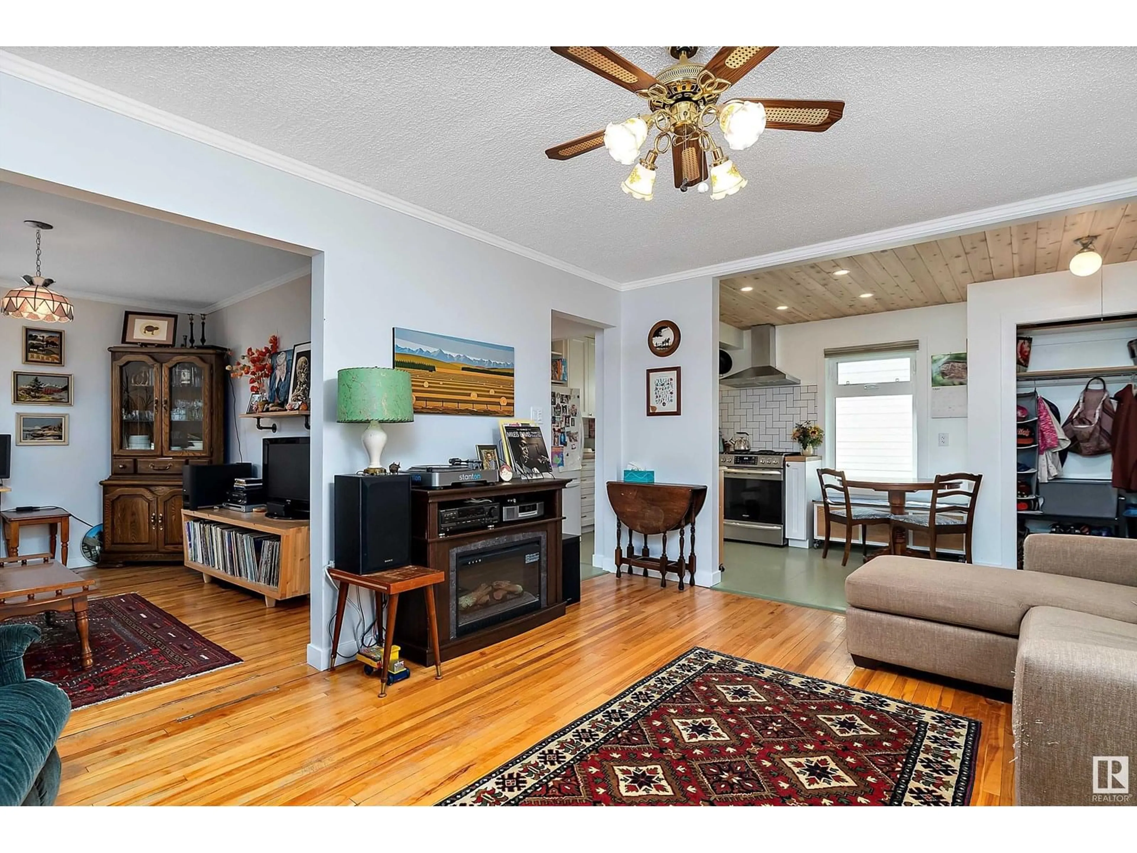 Living room with furniture, wood/laminate floor for 11241 90 ST, Edmonton Alberta T5B3X3