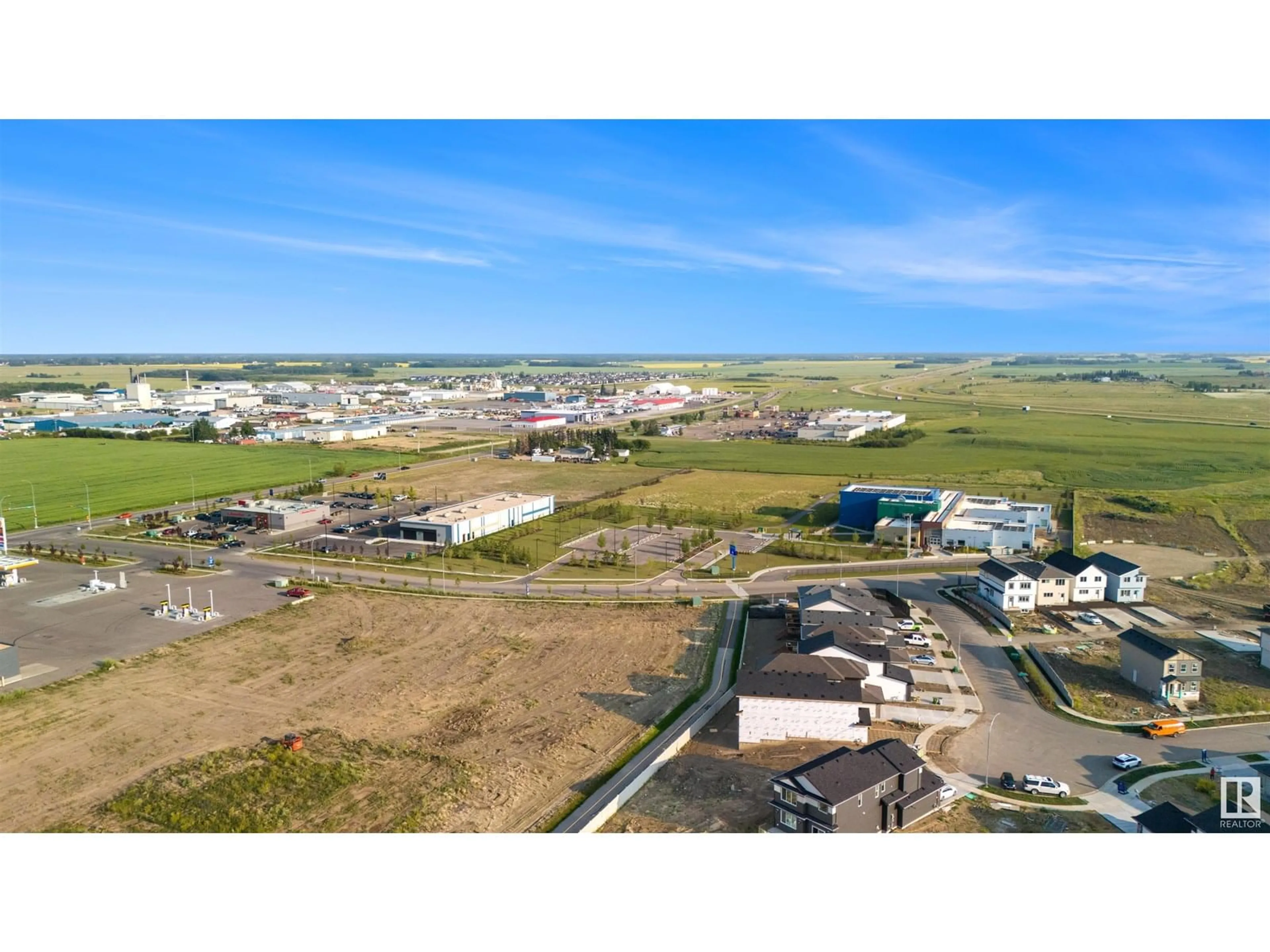 A pic from outside/outdoor area/front of a property/back of a property/a pic from drone, mountain view for 9221 102 ST, Morinville Alberta T8R1A0