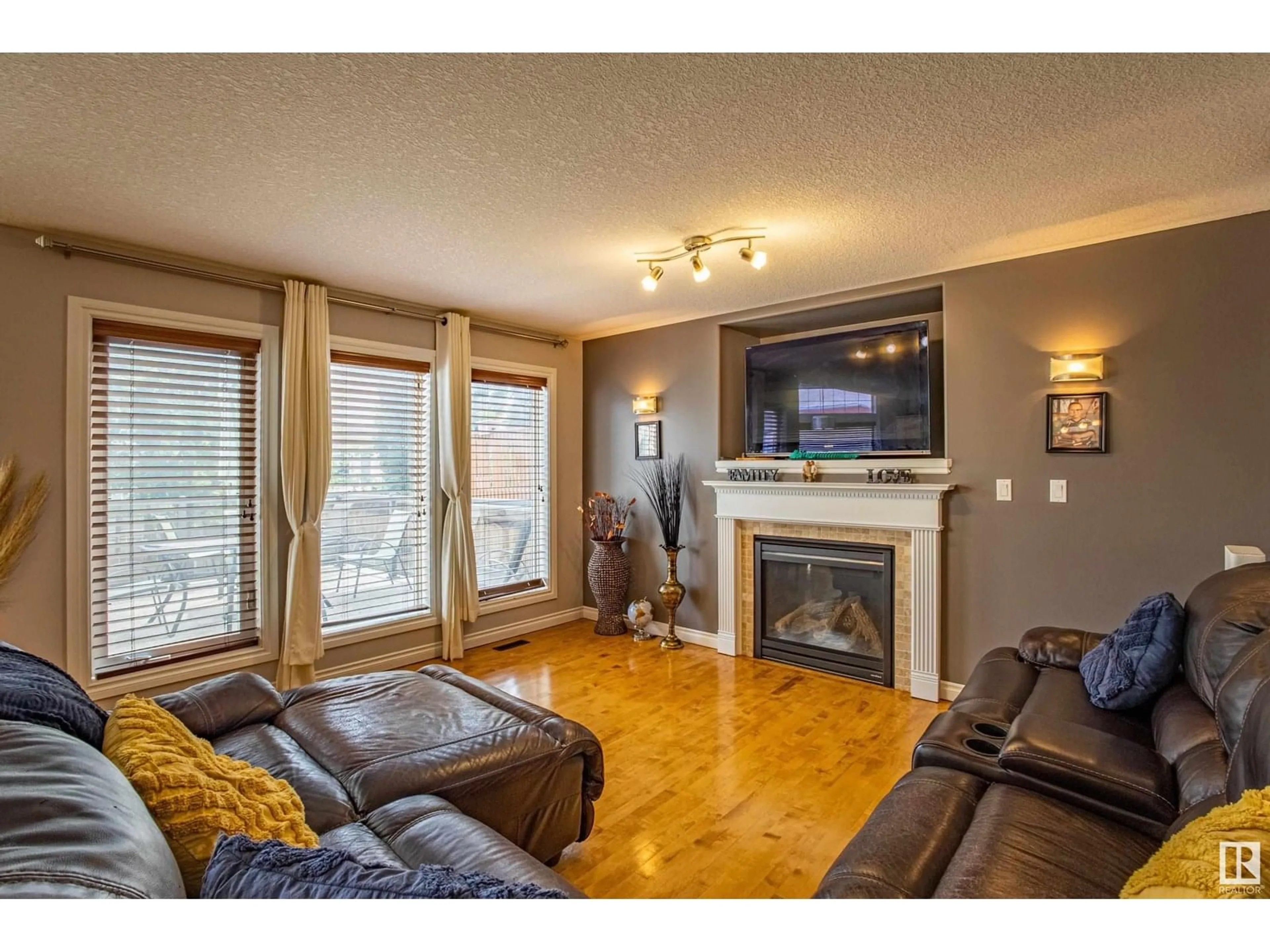 Living room with furniture, wood/laminate floor for 13511 162 AV, Edmonton Alberta T6V0C1