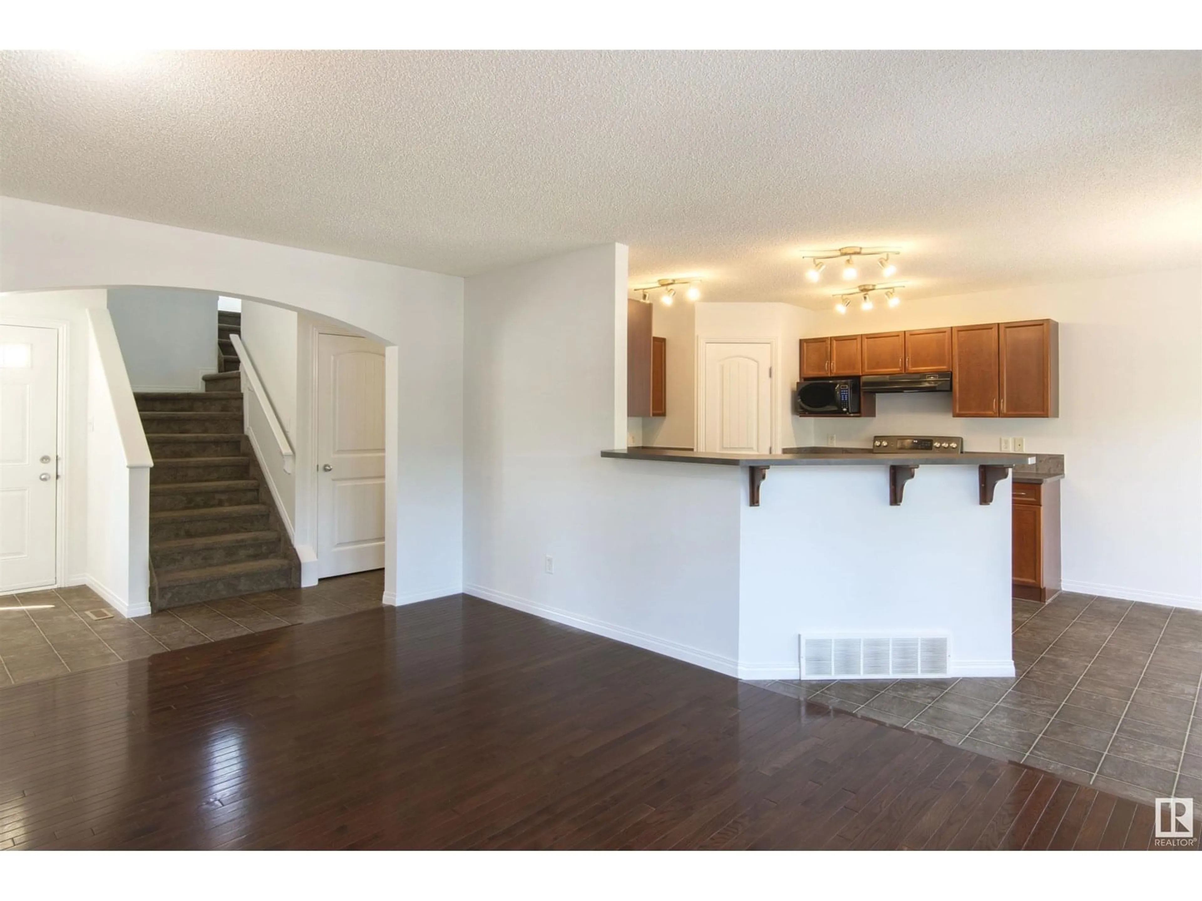 Open concept kitchen, wood/laminate floor for 20428 51 AV, Edmonton Alberta T6M2Z7