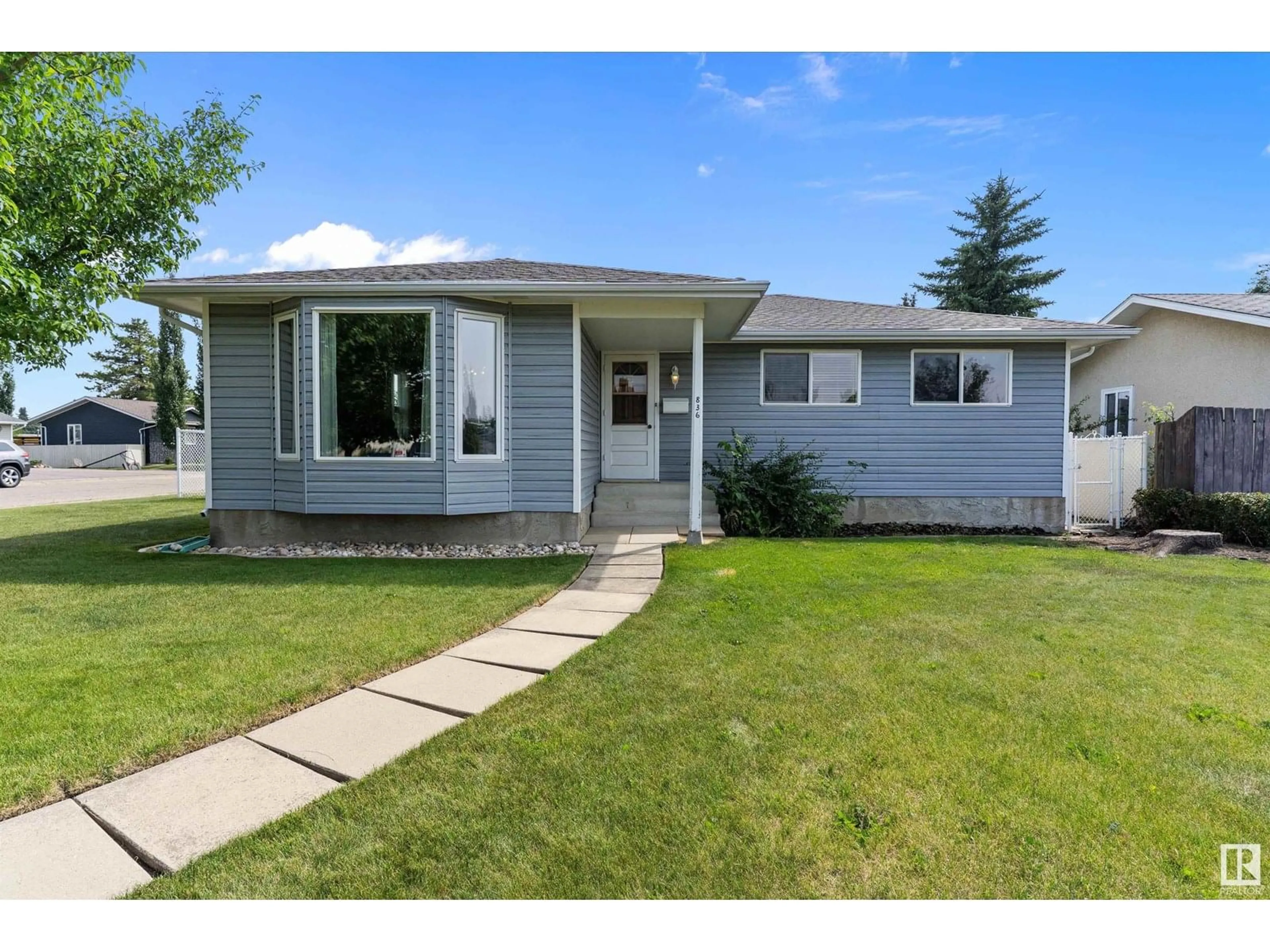 Home with vinyl exterior material, street for NW - 836 KNOTTWOOD RD S, Edmonton Alberta T6K2V2