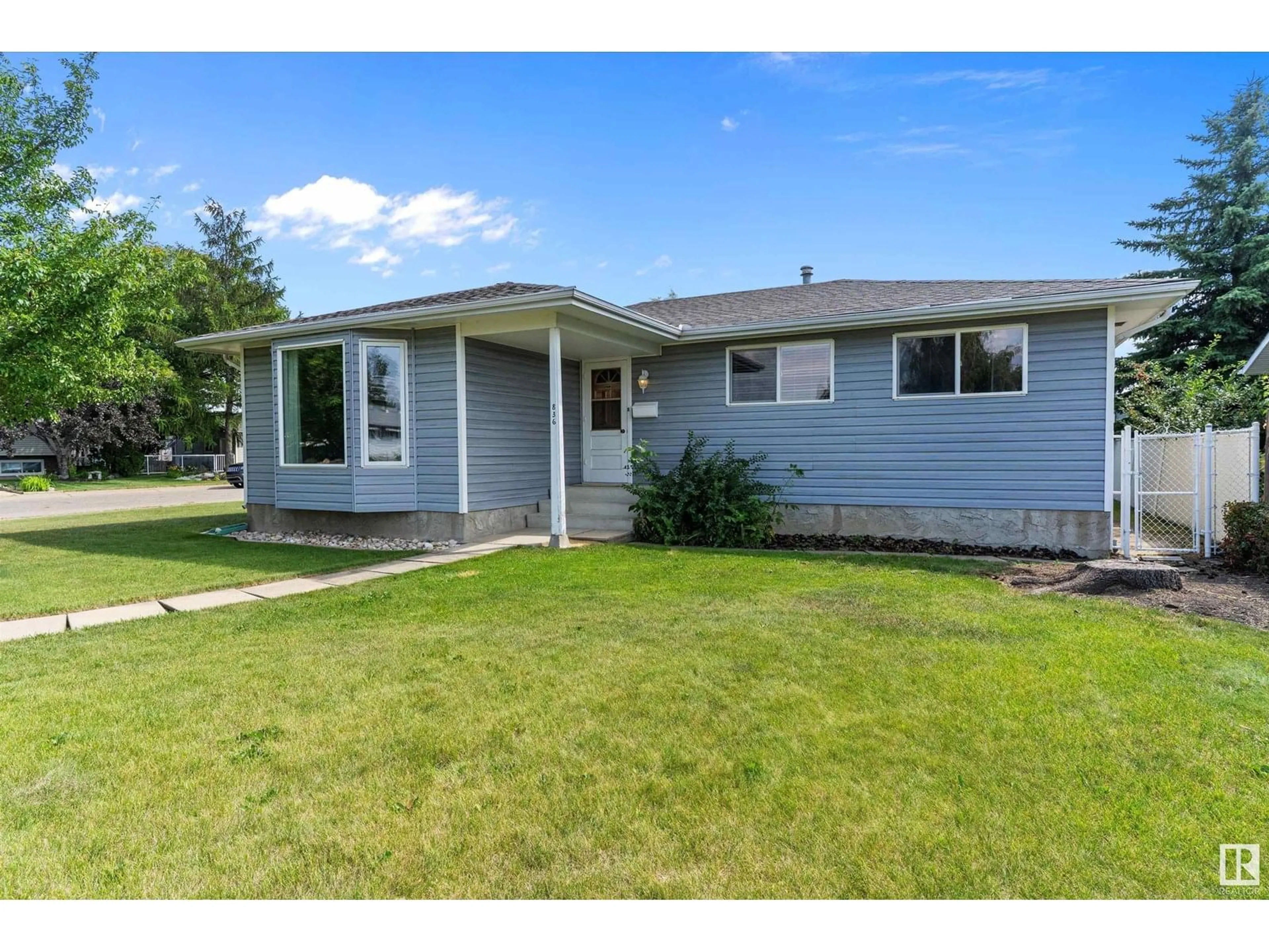 Home with vinyl exterior material, street for NW - 836 KNOTTWOOD RD S, Edmonton Alberta T6K2V2