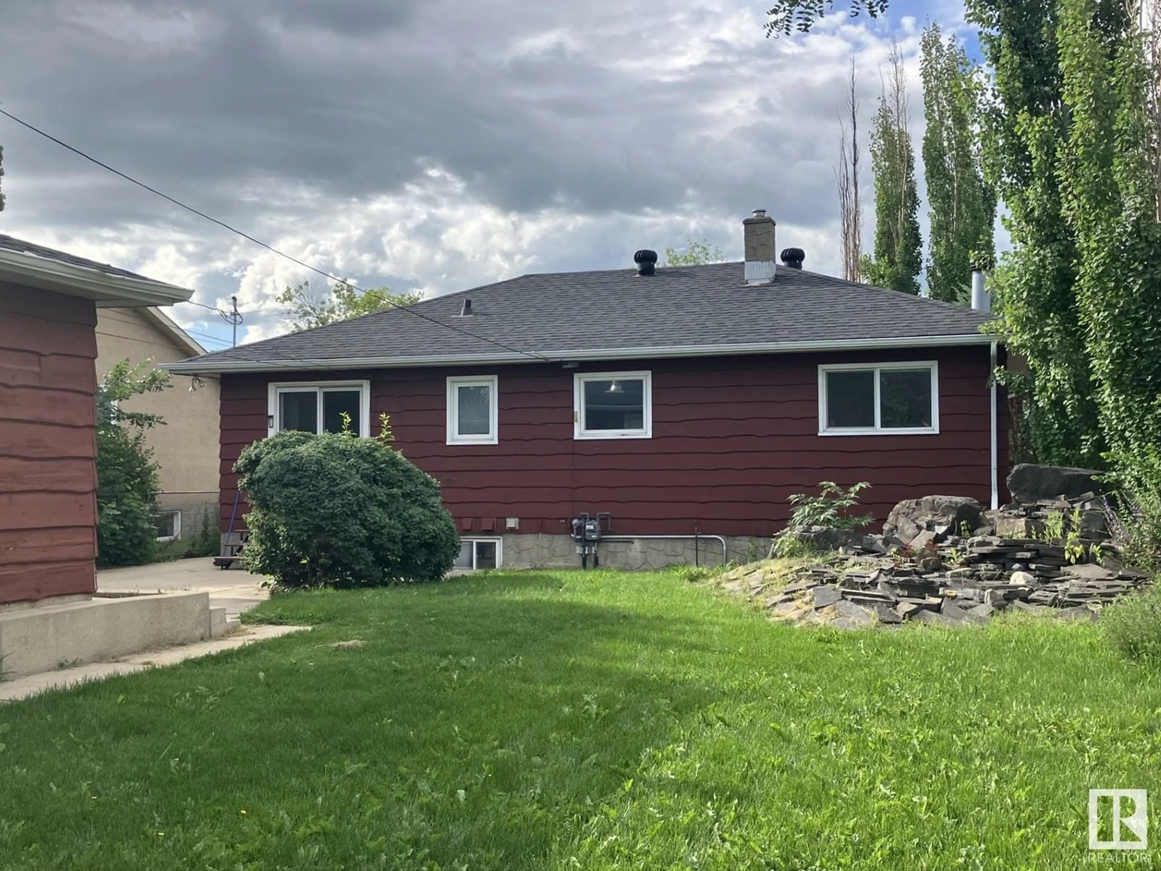 Home with vinyl exterior material, street for 6004 106 AVE, Edmonton Alberta T6A1G5