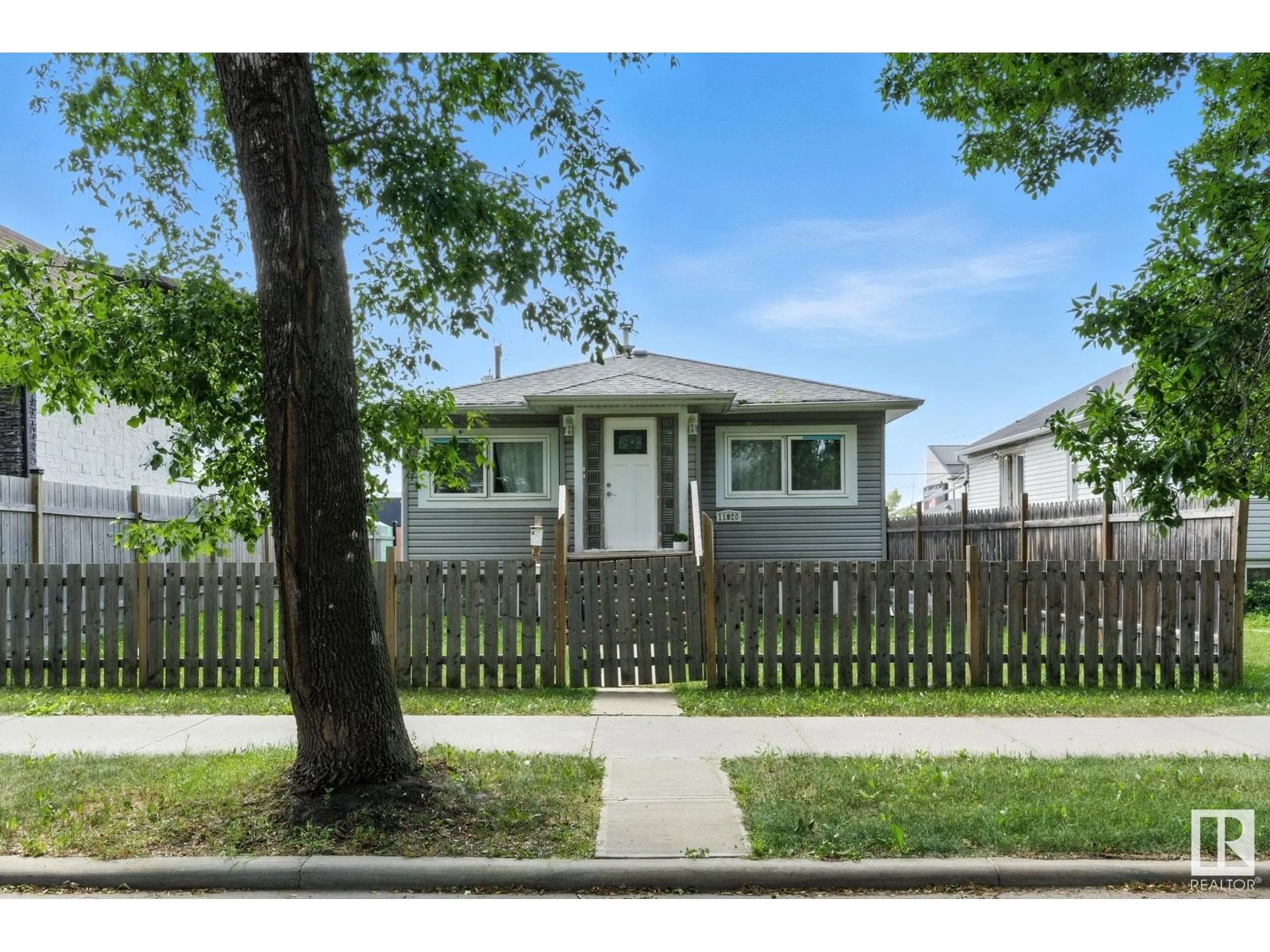 Home with vinyl exterior material, street for 11920 71 ST, Edmonton Alberta T5B1W7