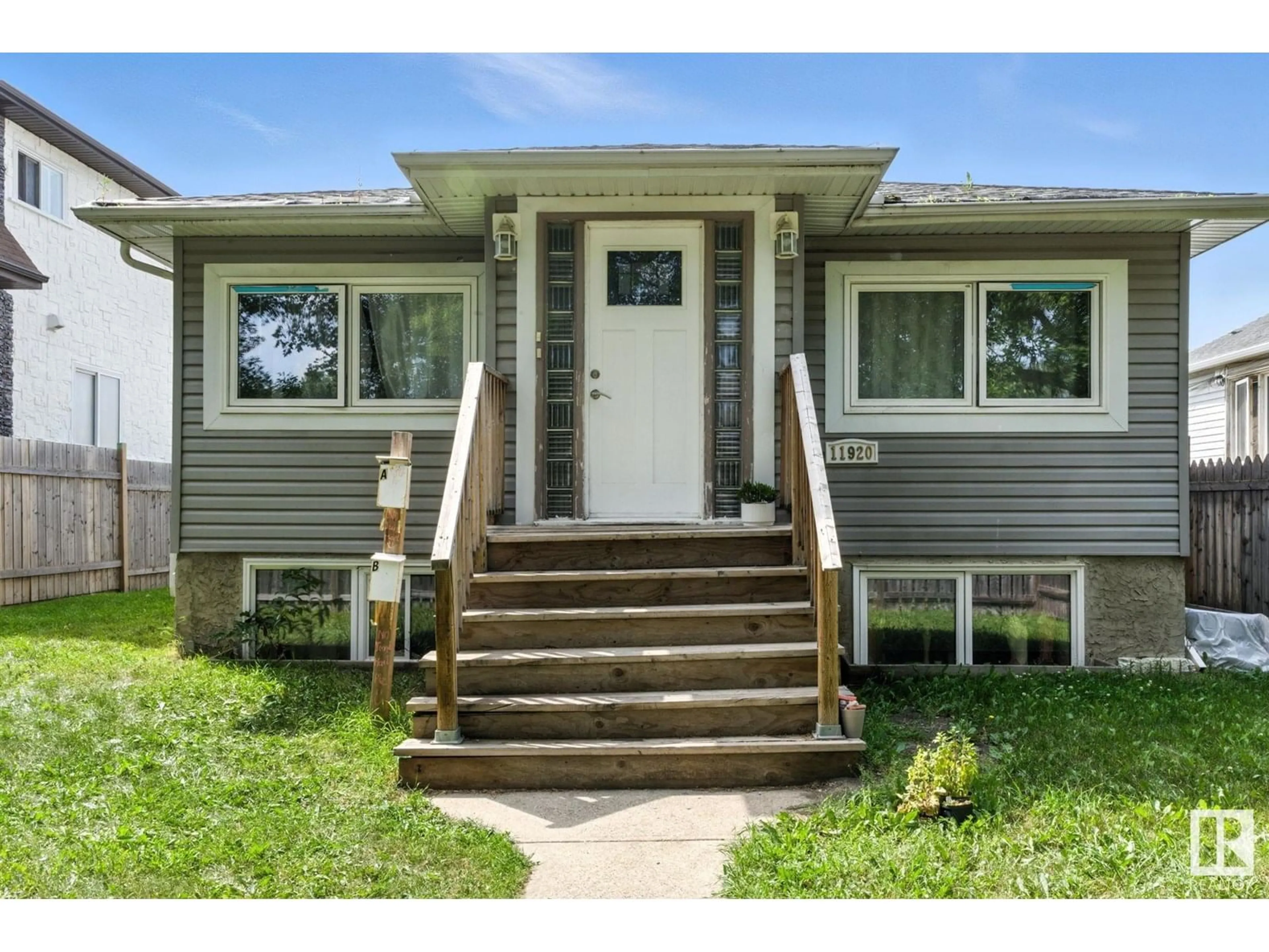 Home with vinyl exterior material, street for 11920 71 ST, Edmonton Alberta T5B1W7