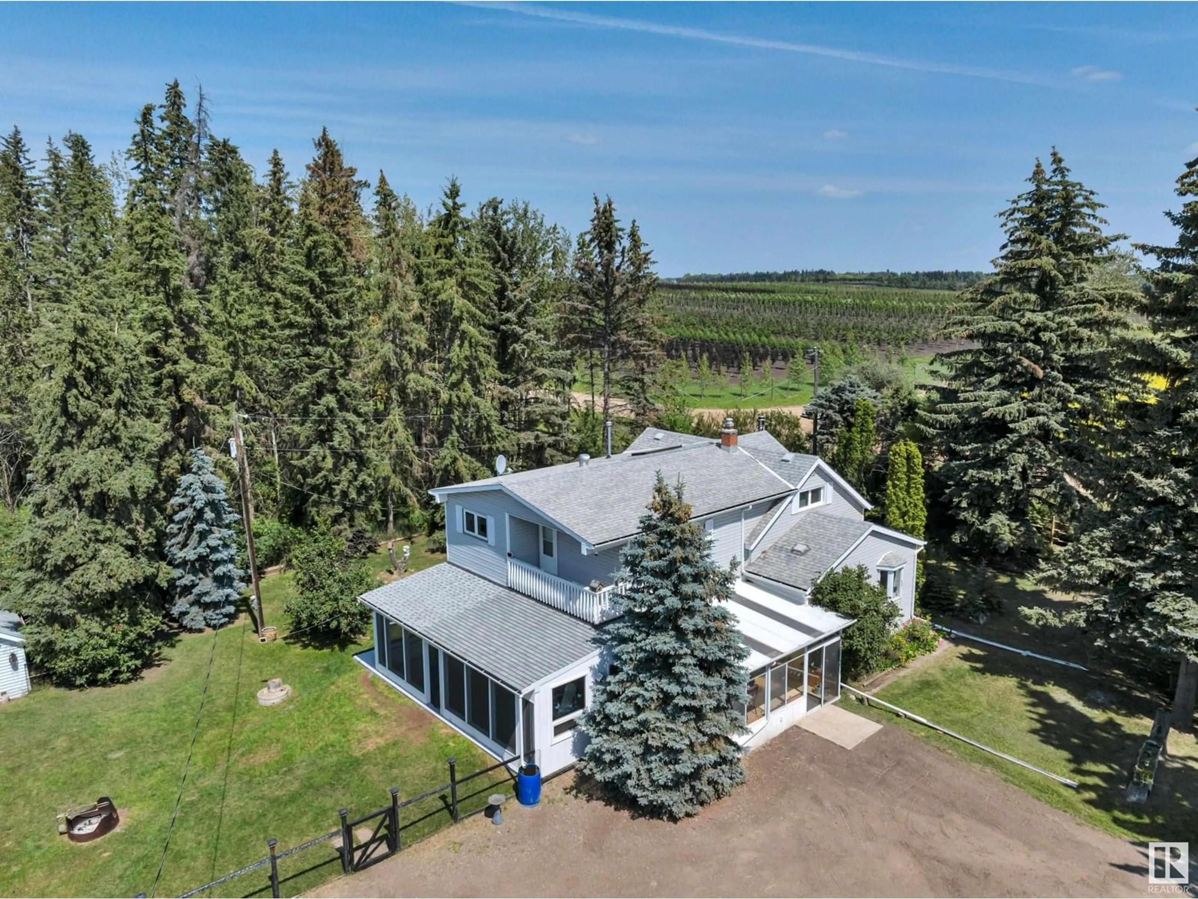 A pic from outside/outdoor area/front of a property/back of a property/a pic from drone, water/lake/river/ocean view for 50340 RGE ROAD 241, Rural Leduc County Alberta T4X0M9