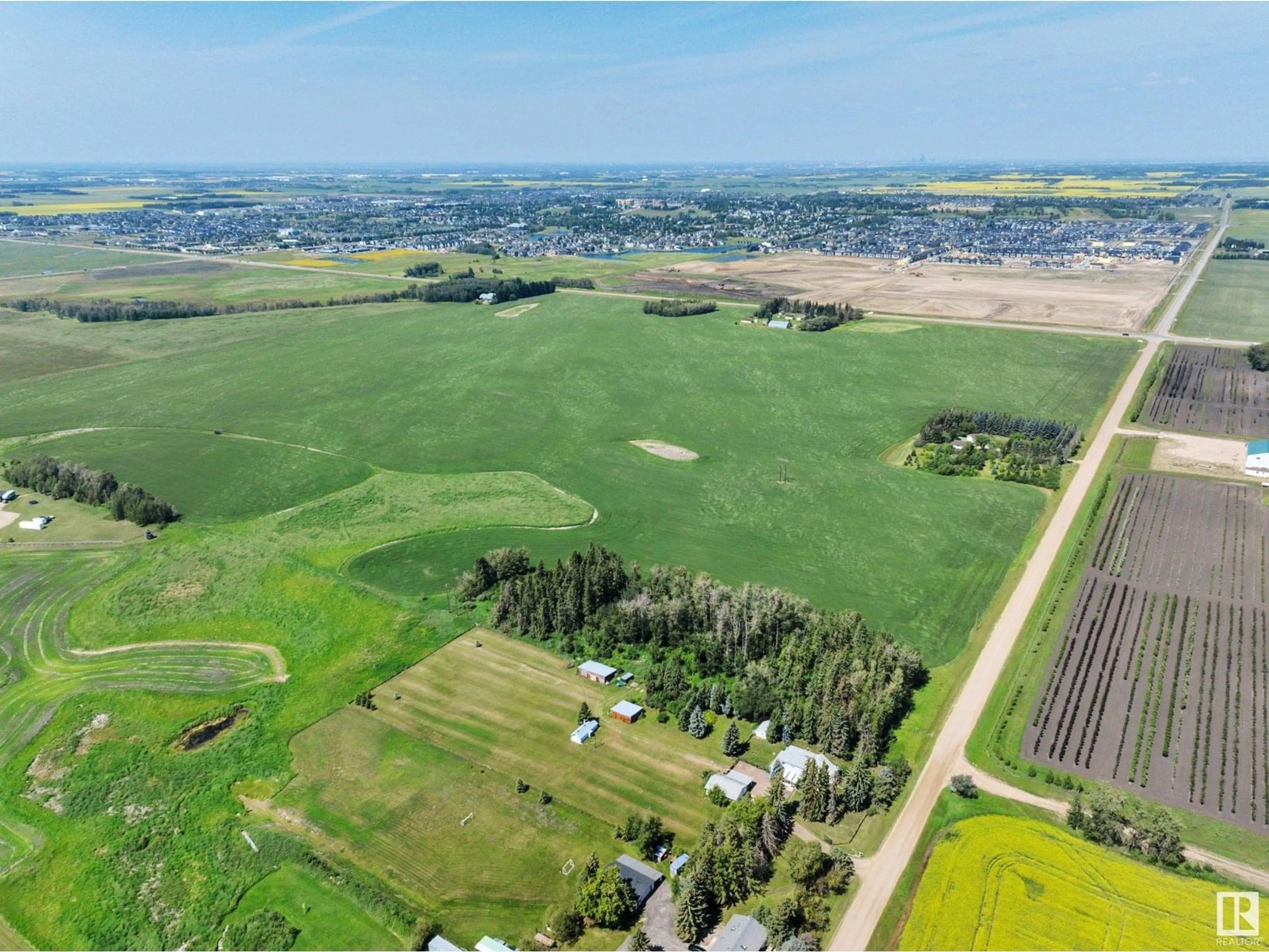 A pic from outside/outdoor area/front of a property/back of a property/a pic from drone, mountain view for 50340 RGE ROAD 241, Rural Leduc County Alberta T4X0M9