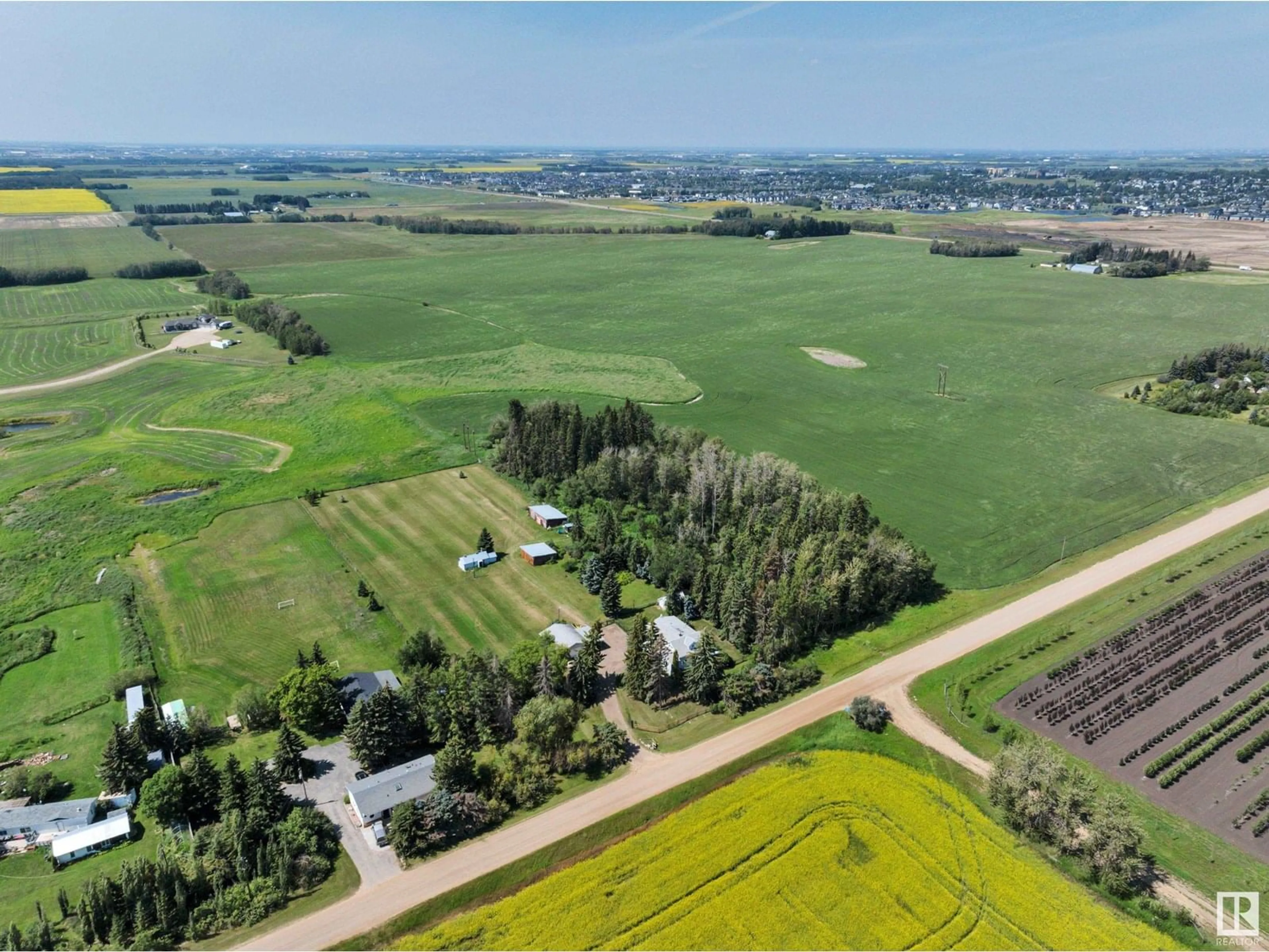 A pic from outside/outdoor area/front of a property/back of a property/a pic from drone, mountain view for 50340 RGE ROAD 241, Rural Leduc County Alberta T4X0M9