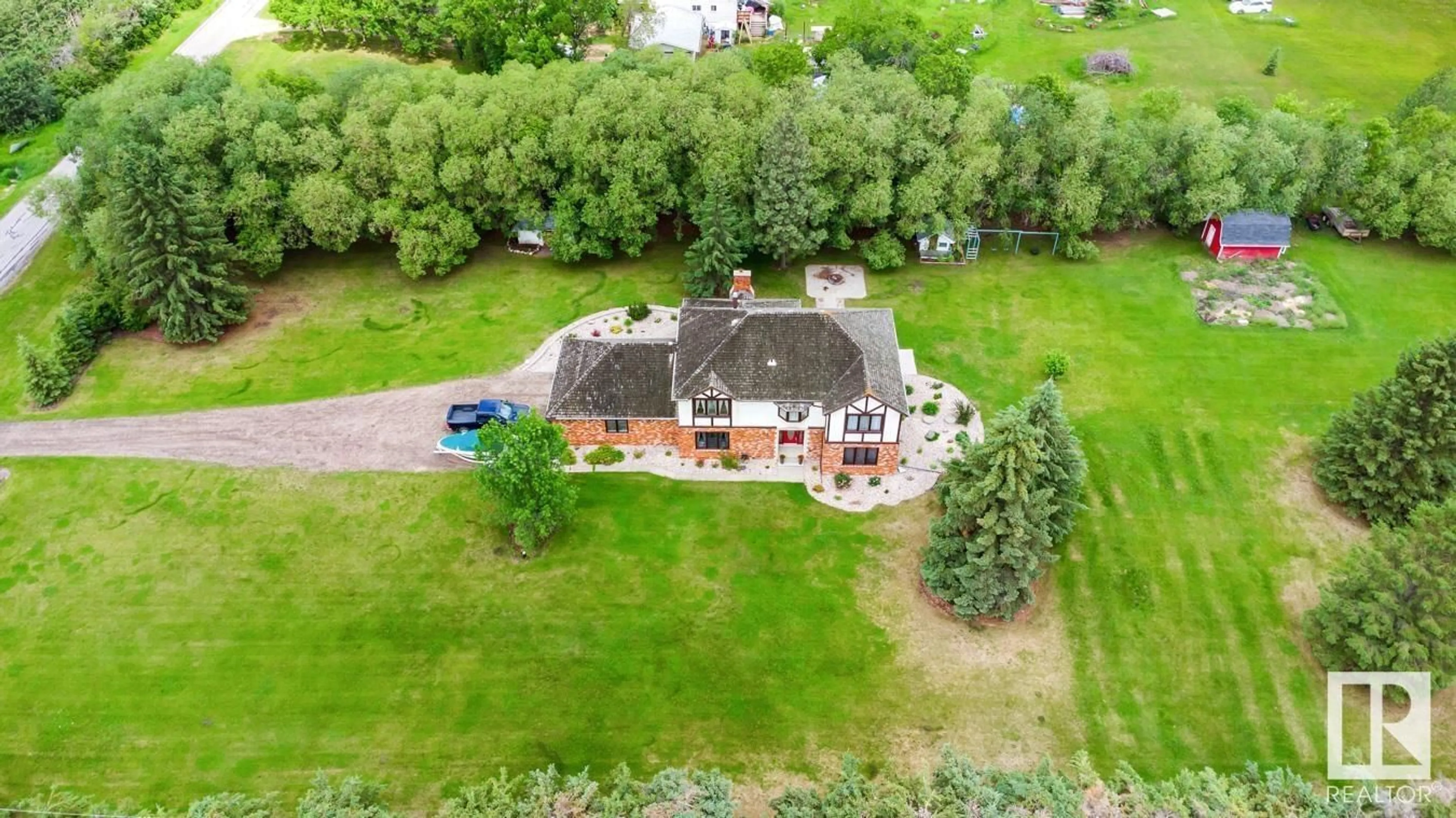 A pic from outside/outdoor area/front of a property/back of a property/a pic from drone, unknown for 22112 TWP ROAD 531, Rural Strathcona County Alberta T8E2E3