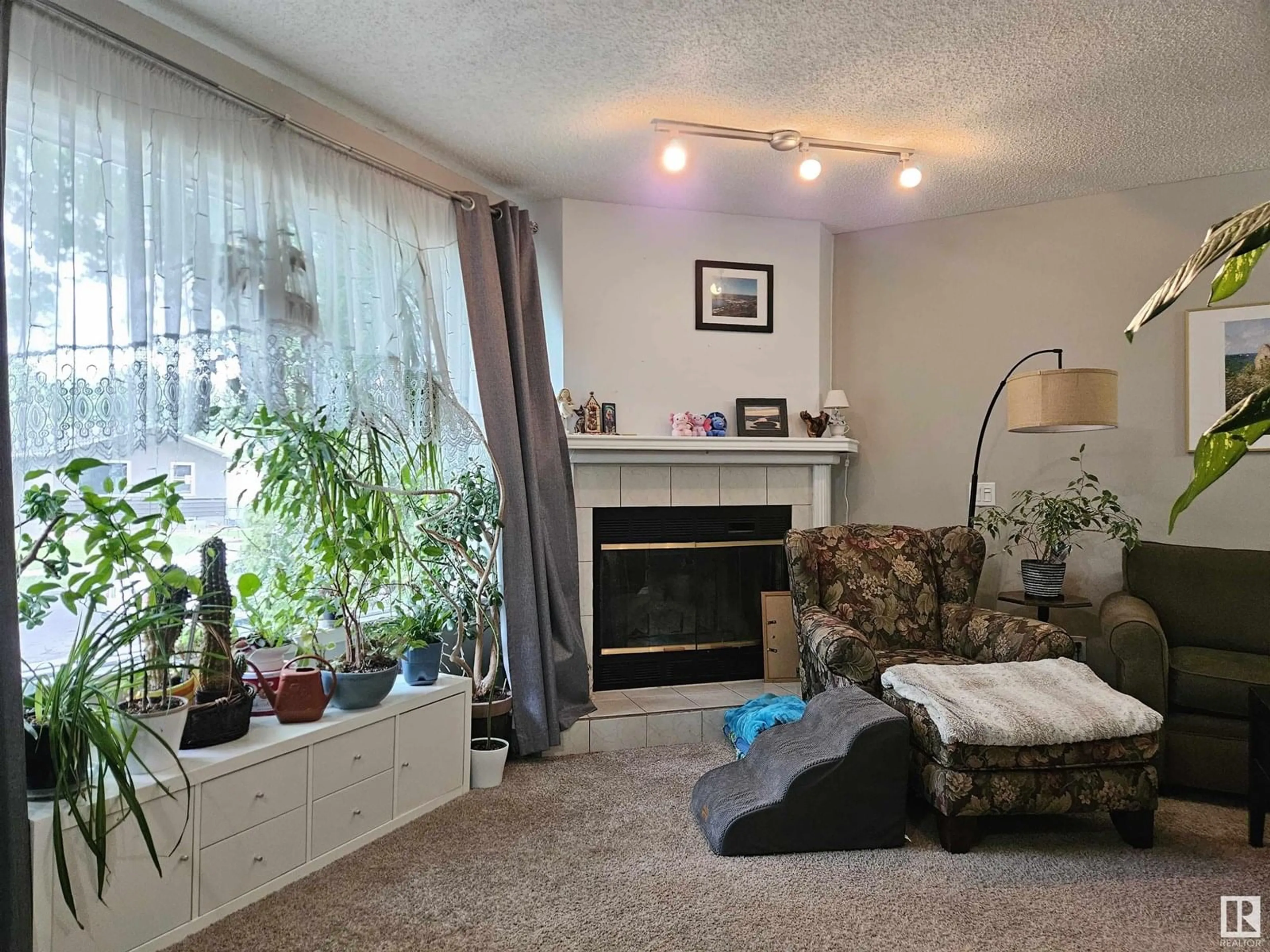 Living room with furniture, unknown for 11811 51 ST, Edmonton Alberta T5W3G3