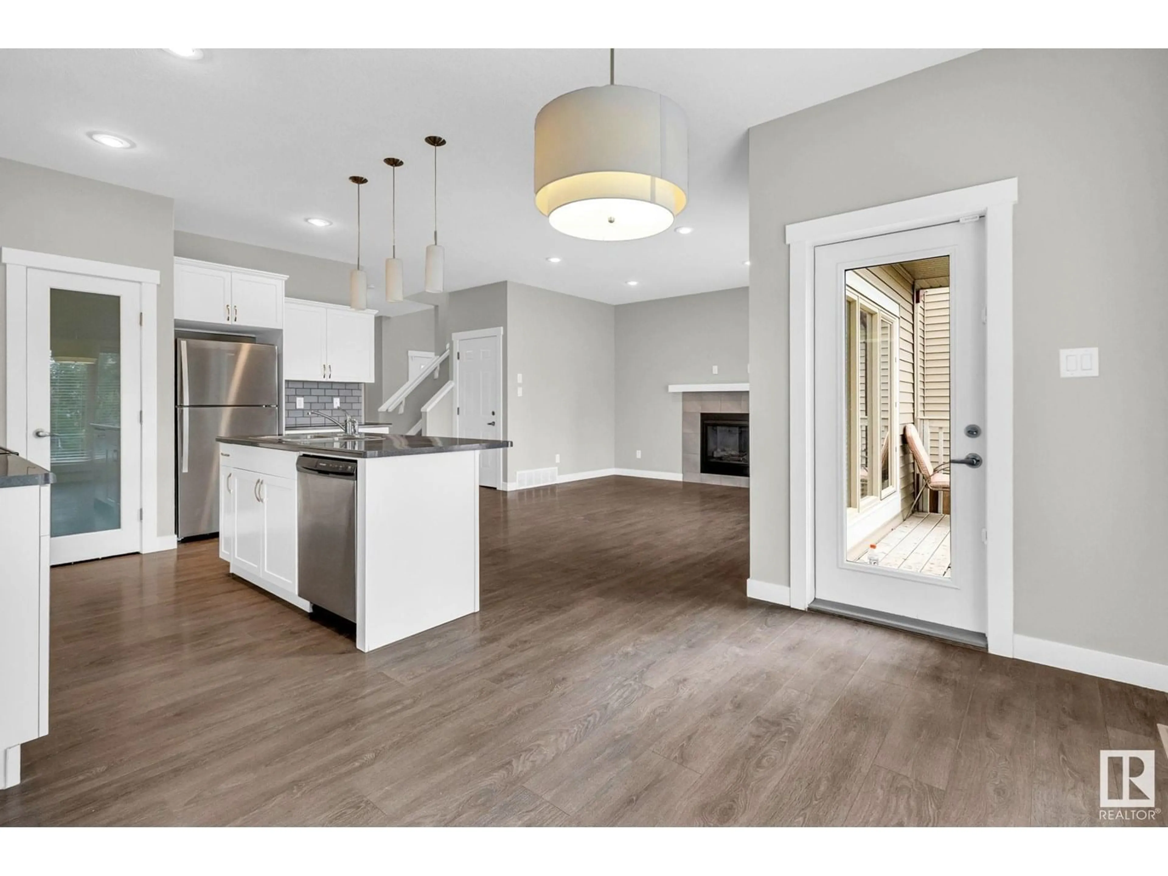 Open concept kitchen, wood/laminate floor for SW - 1348 AINSLIE WD, Edmonton Alberta T6W3G1