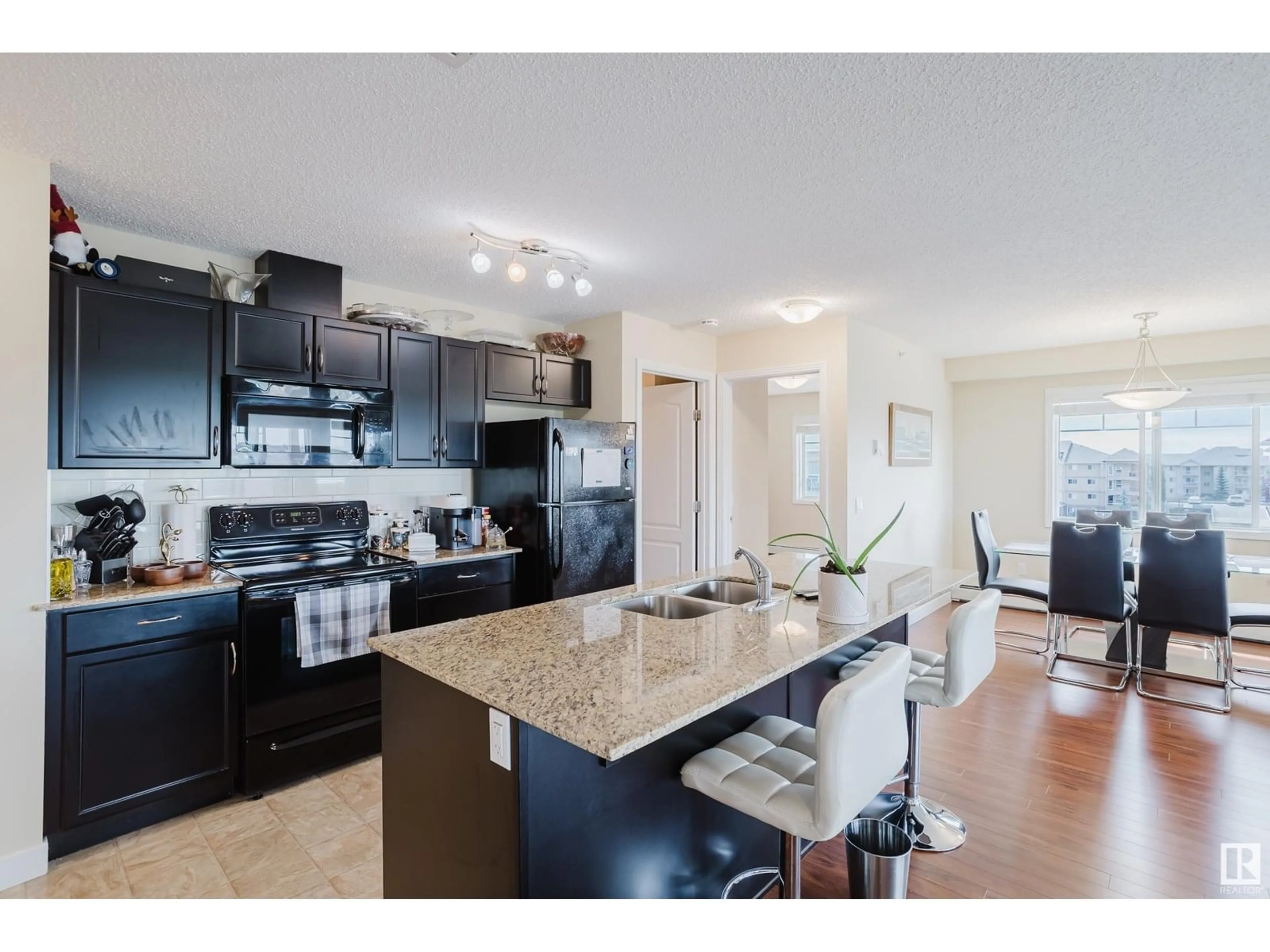 Open concept kitchen, unknown for #415 - 12650 142 AV, Edmonton Alberta T5X0J4