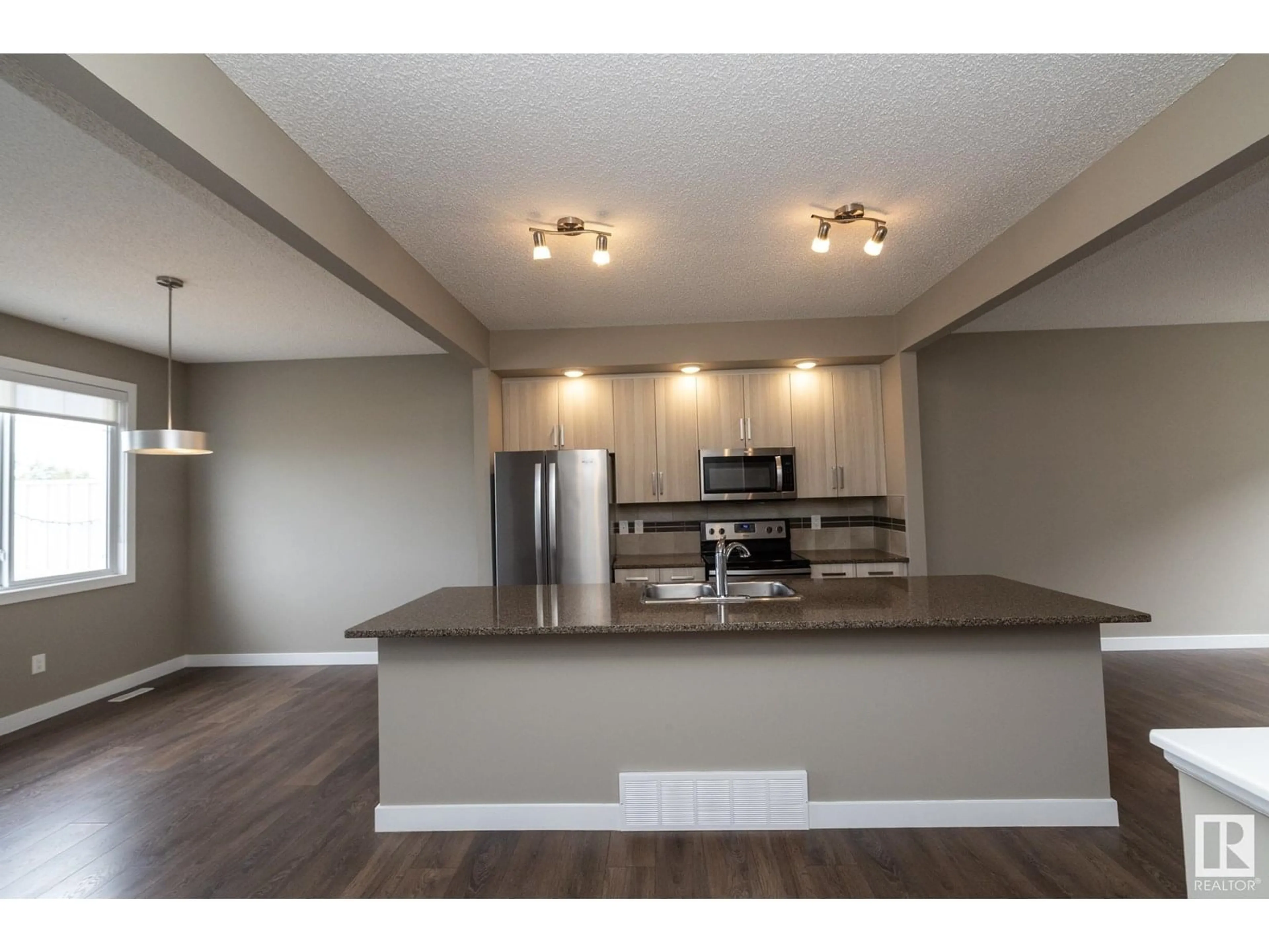 Open concept kitchen, wood/laminate floor for 13139 - 72 205 ST NW, Edmonton Alberta T5S0N1