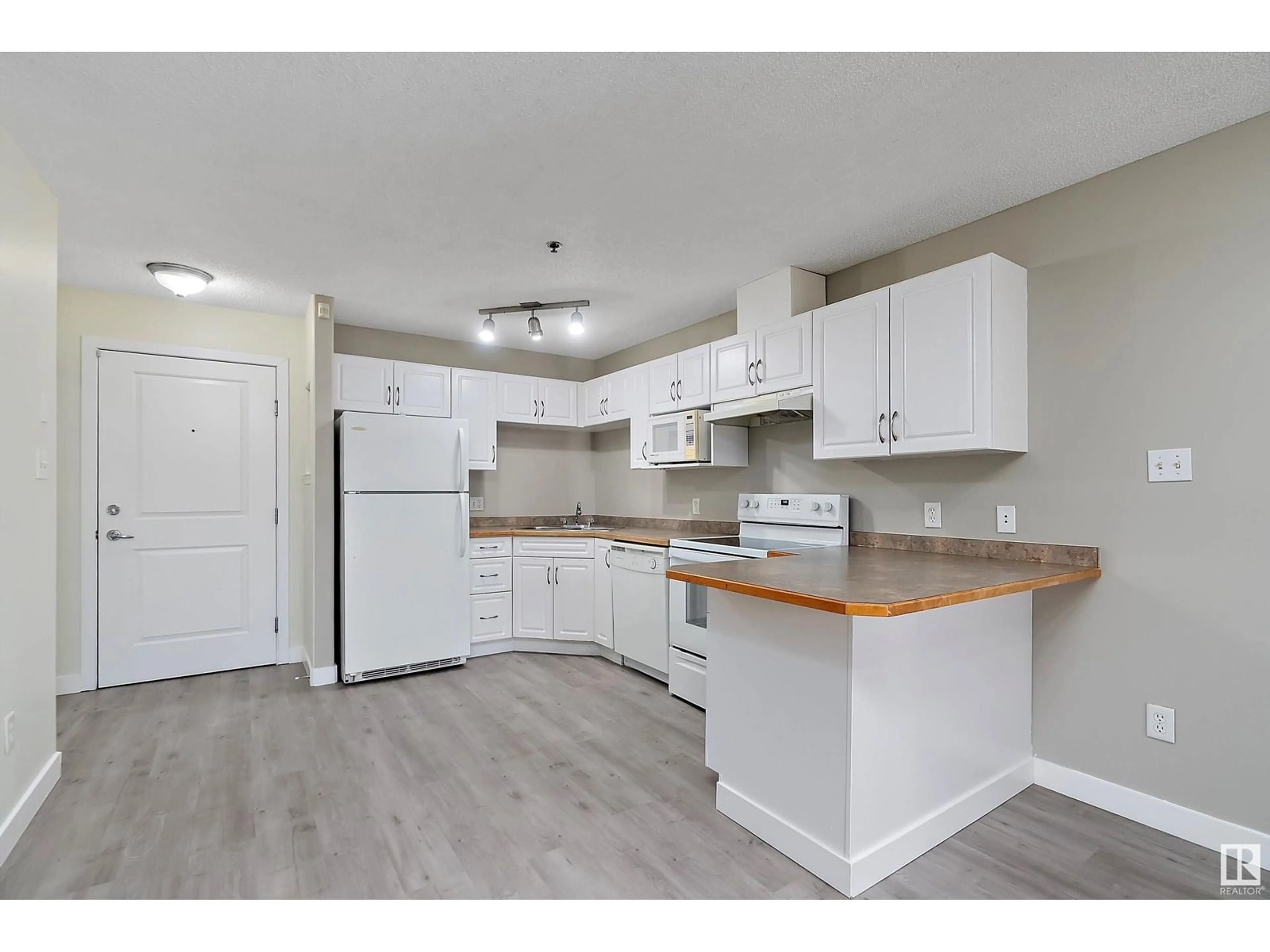 Standard kitchen, wood/laminate floor for #123 - 2305 35A AV, Edmonton Alberta T6T1Z2