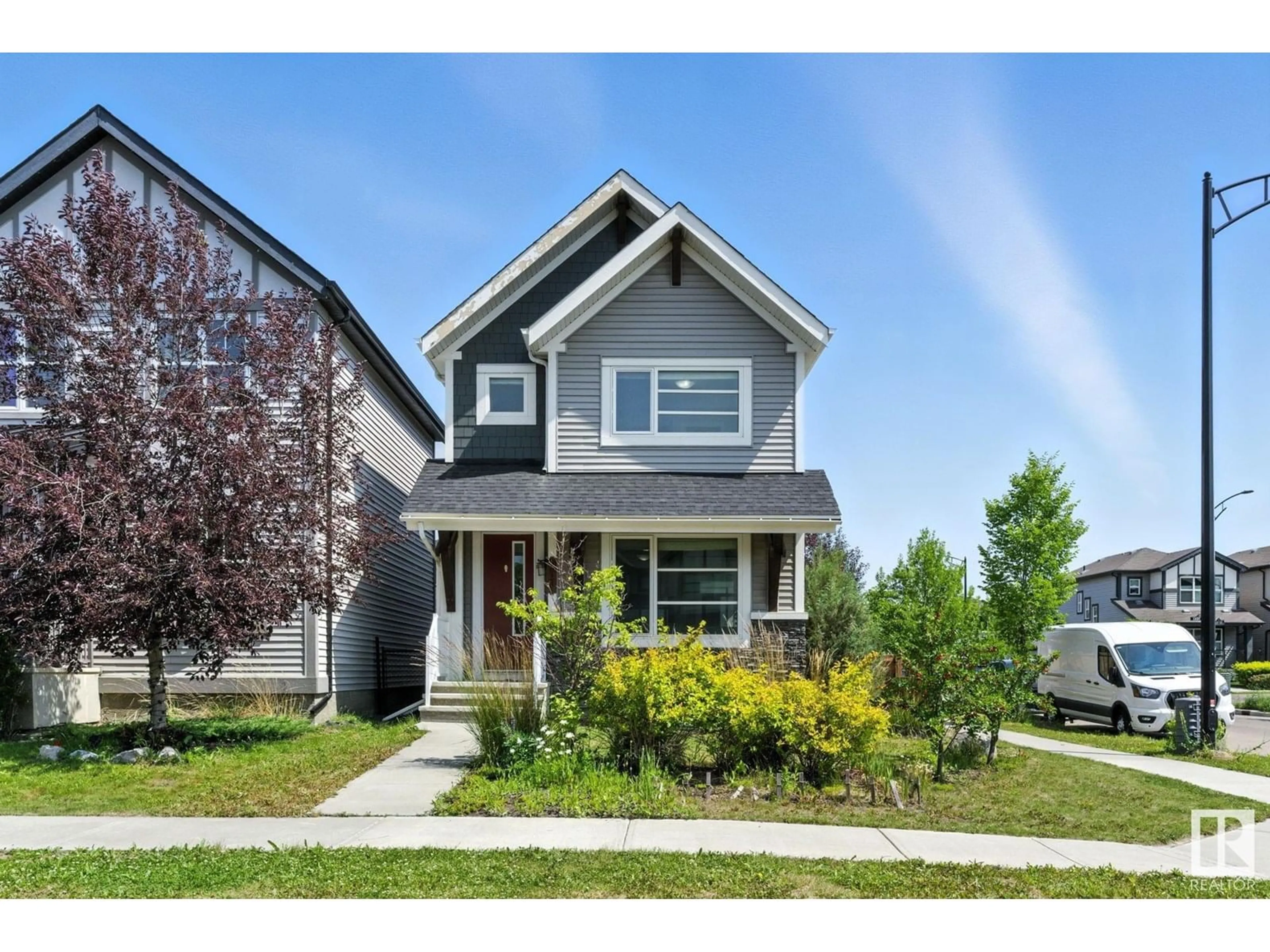 Home with vinyl exterior material, street for 2033 CAVANAGH DR, Edmonton Alberta T6W3M7