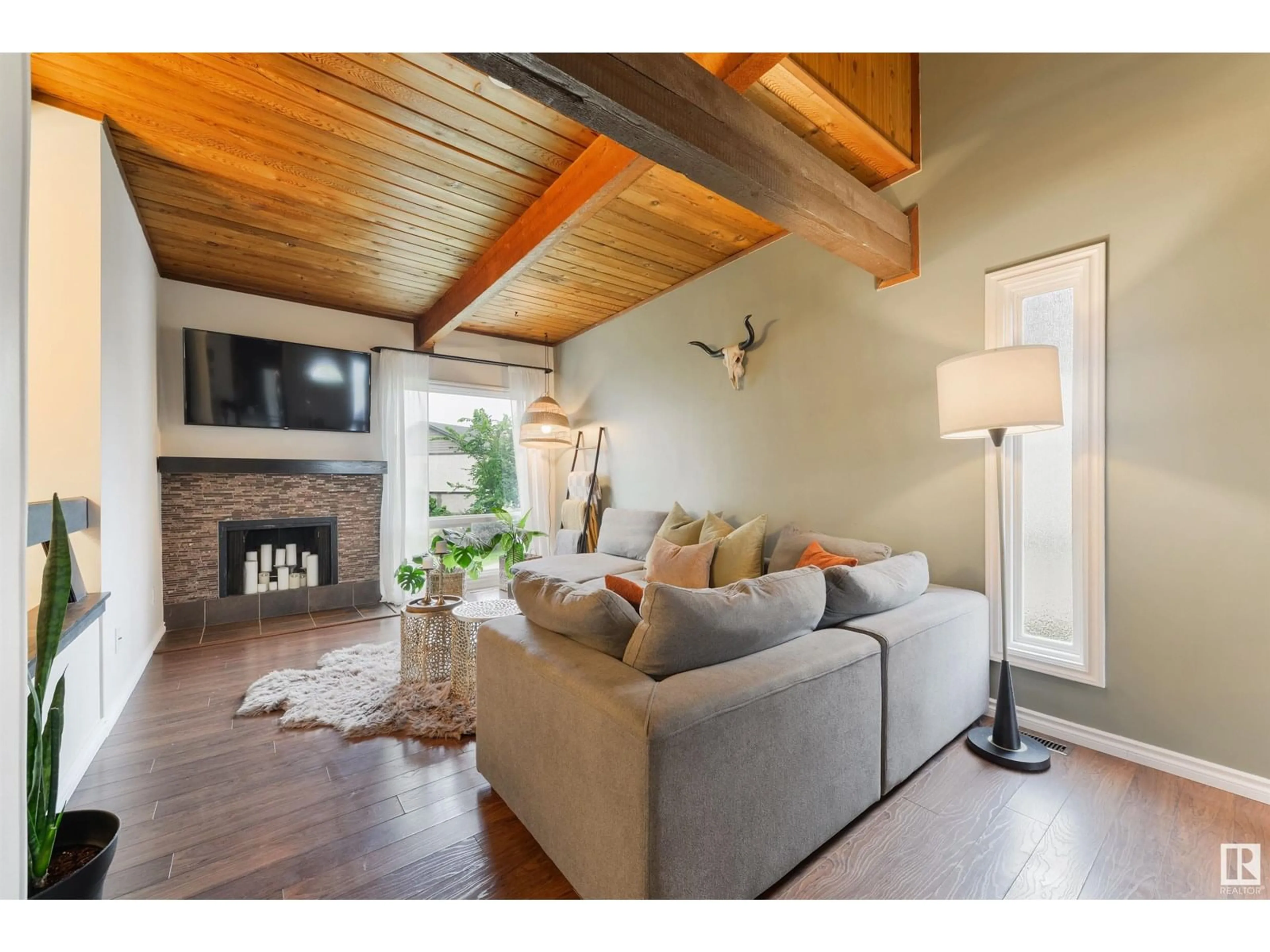 Living room with furniture, wood/laminate floor for 67 NORTHWOODS VG, Edmonton Alberta T5X1T2