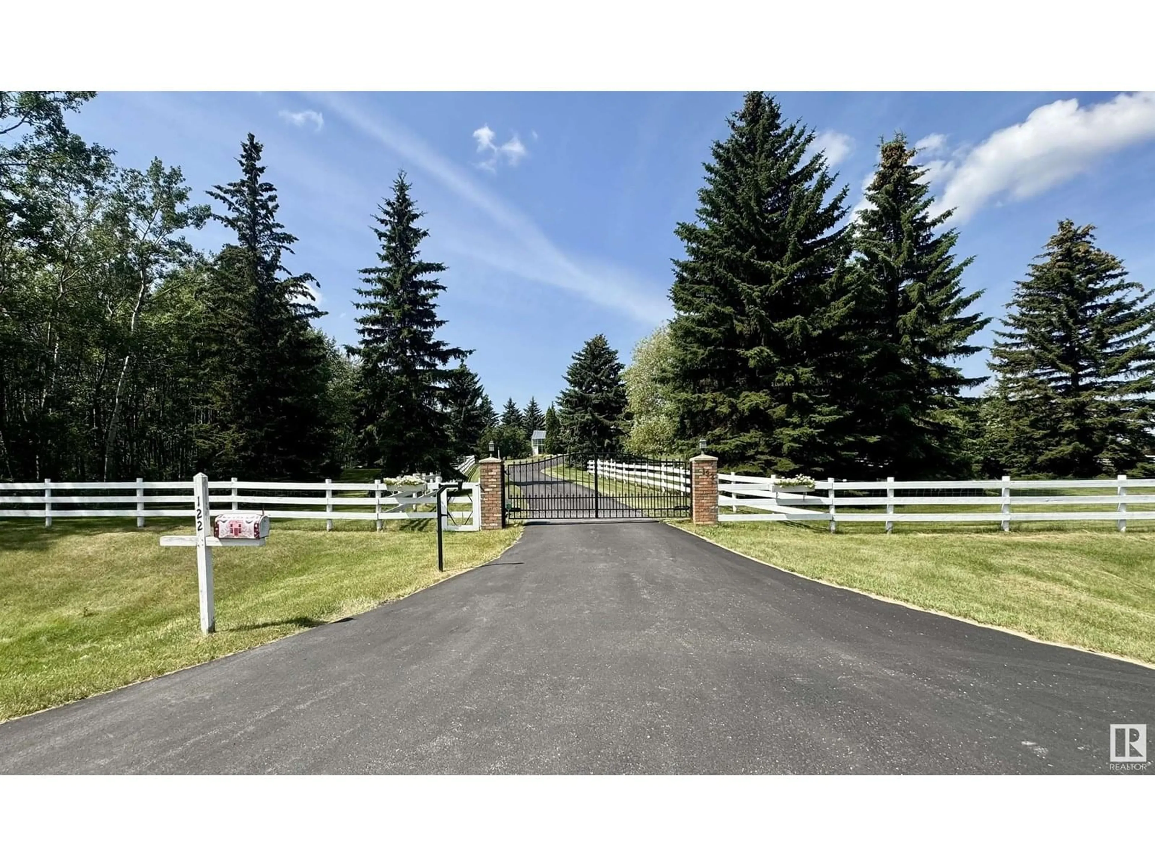 A pic from outside/outdoor area/front of a property/back of a property/a pic from drone, mountain view for 122 52319 RGE ROAD 231, Rural Strathcona County Alberta T8B1A8