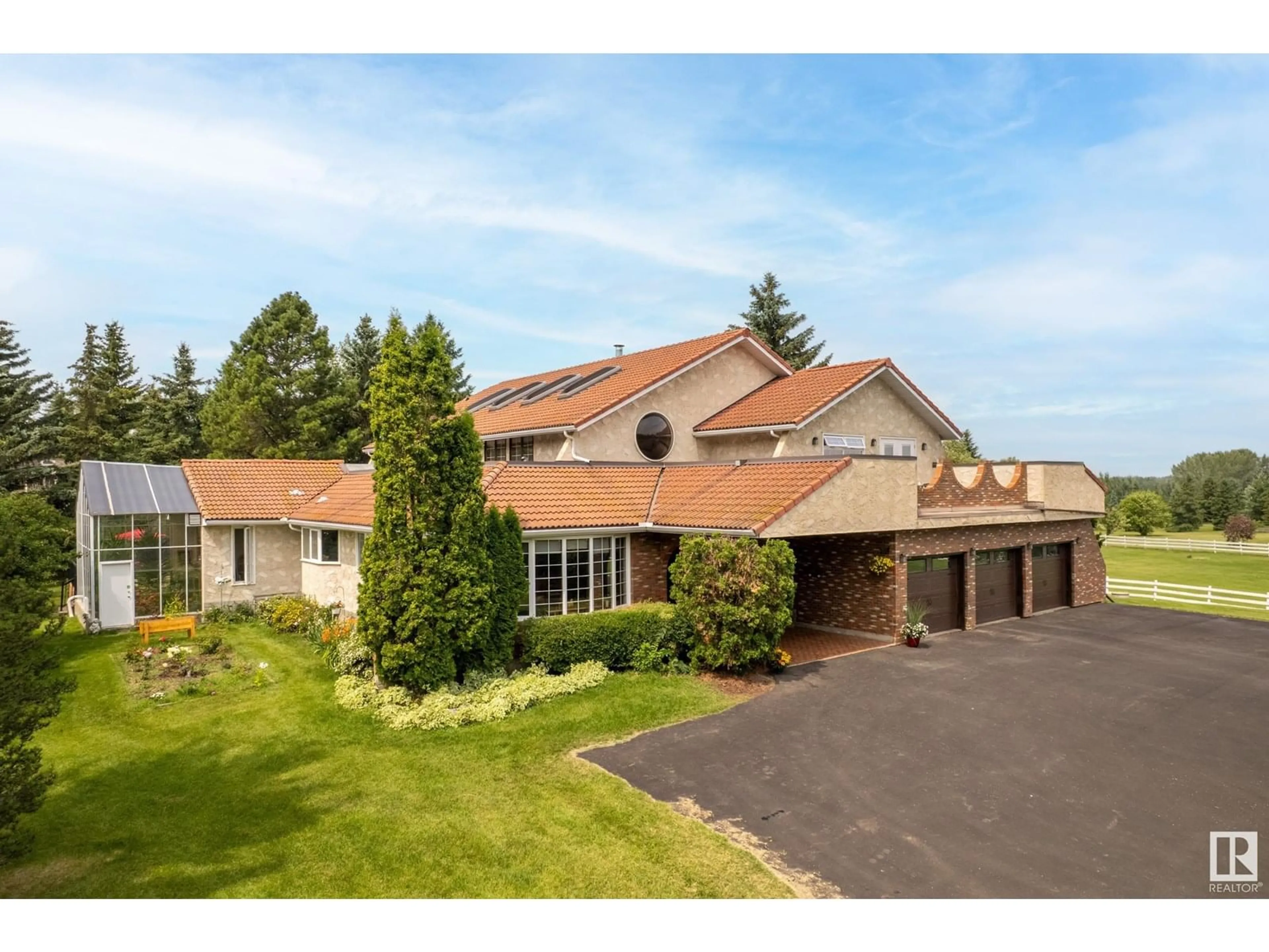 A pic from outside/outdoor area/front of a property/back of a property/a pic from drone, street for 122 52319 RGE ROAD 231, Rural Strathcona County Alberta T8B1A8