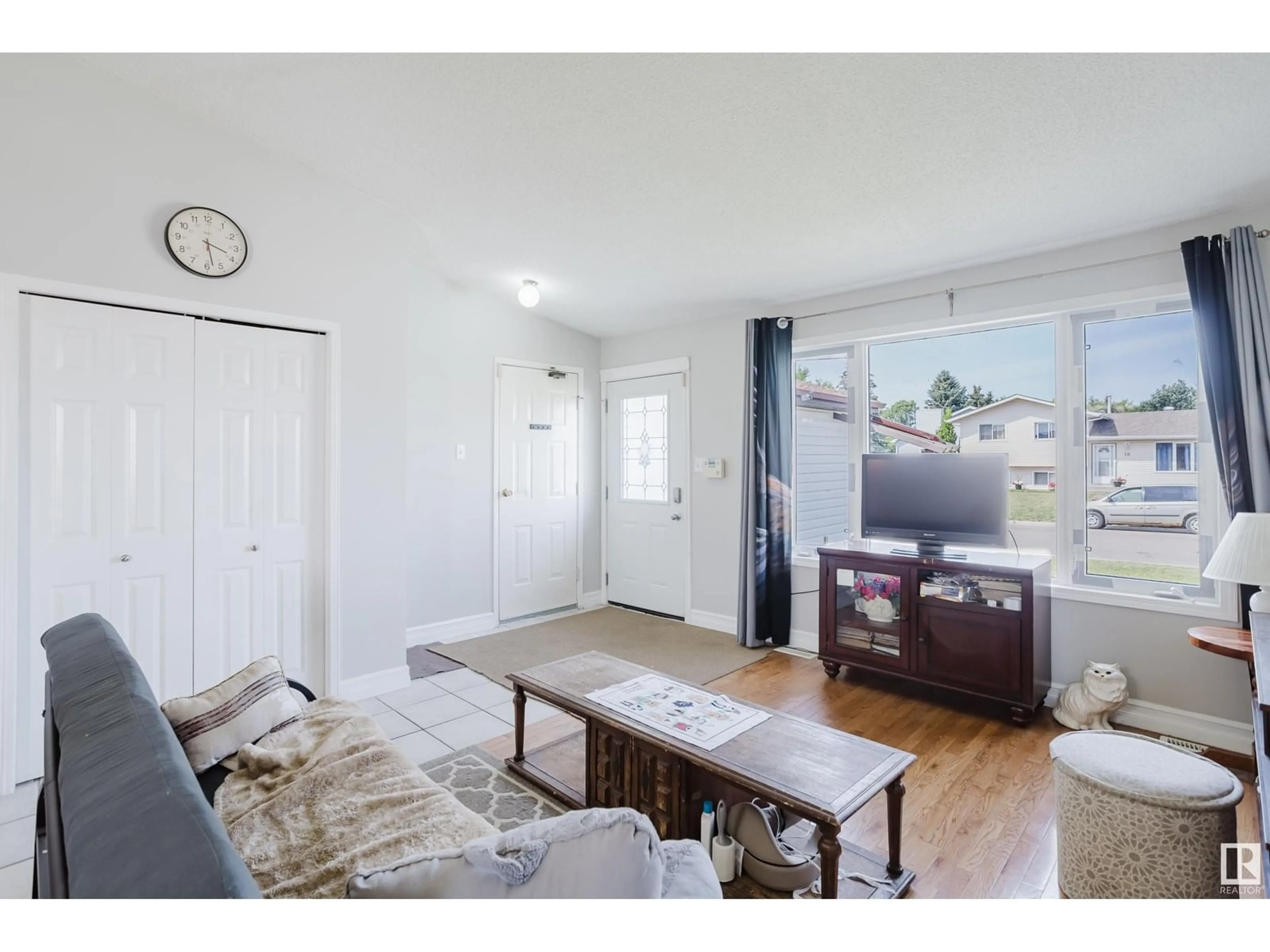 Living room with furniture, wood/laminate floor for 35 GLENWOOD CR, Stony Plain Alberta T7Z1A3