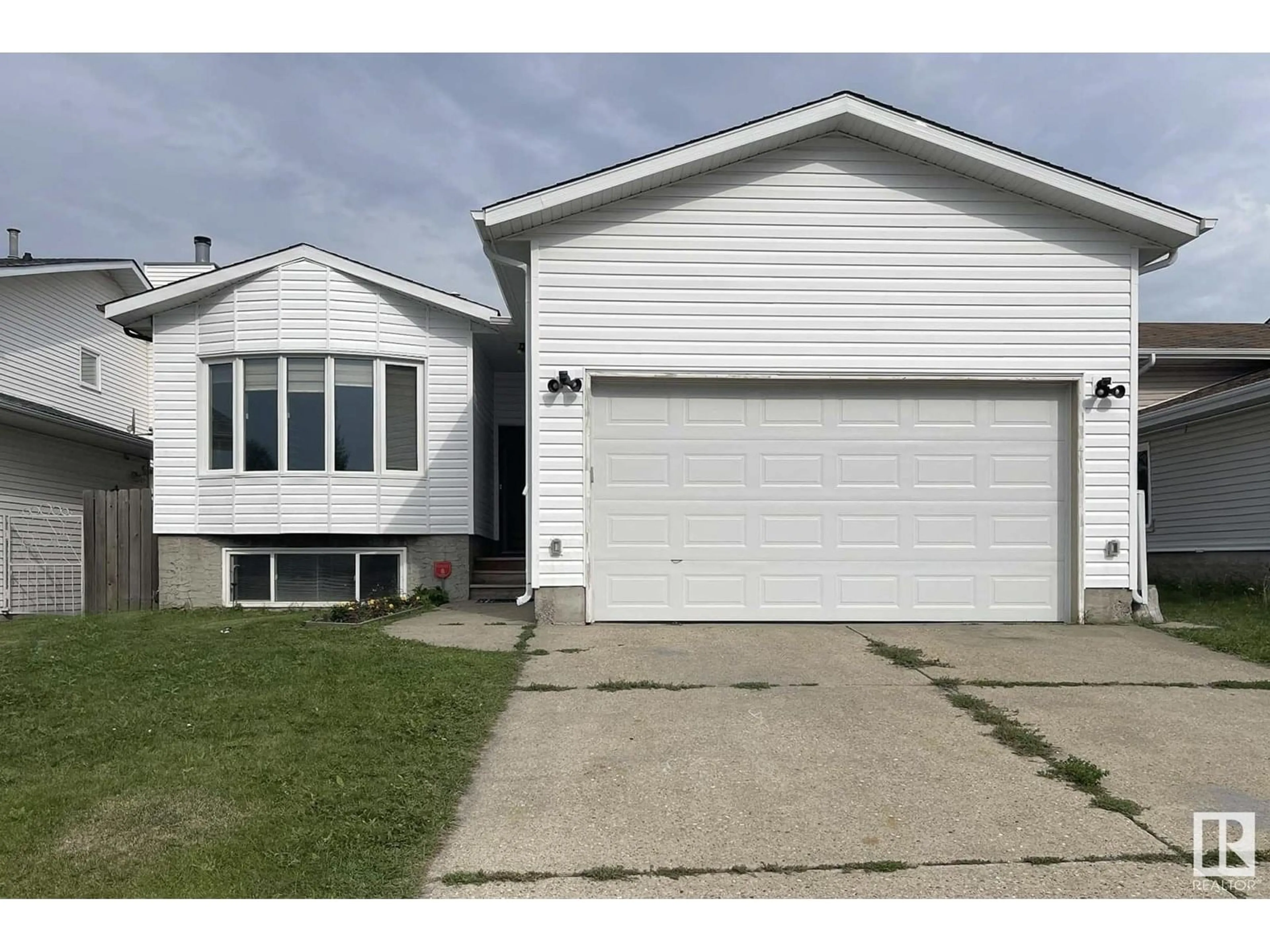 Home with vinyl exterior material, street for 2831 36 ST NW, Edmonton Alberta T6L3Y6