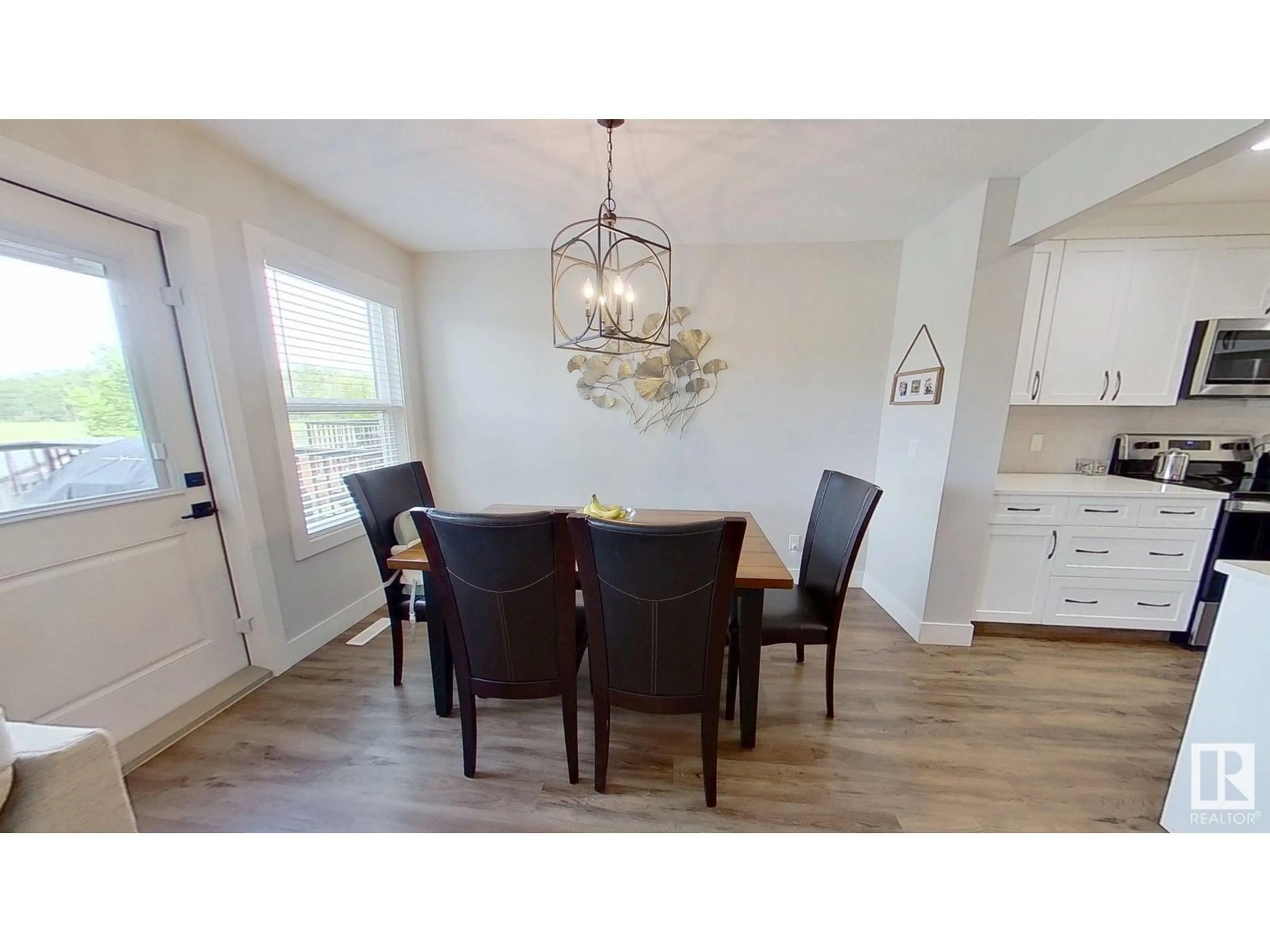 Dining room, wood/laminate floor for 922 MORRIS WY, Leduc Alberta T9E1E9