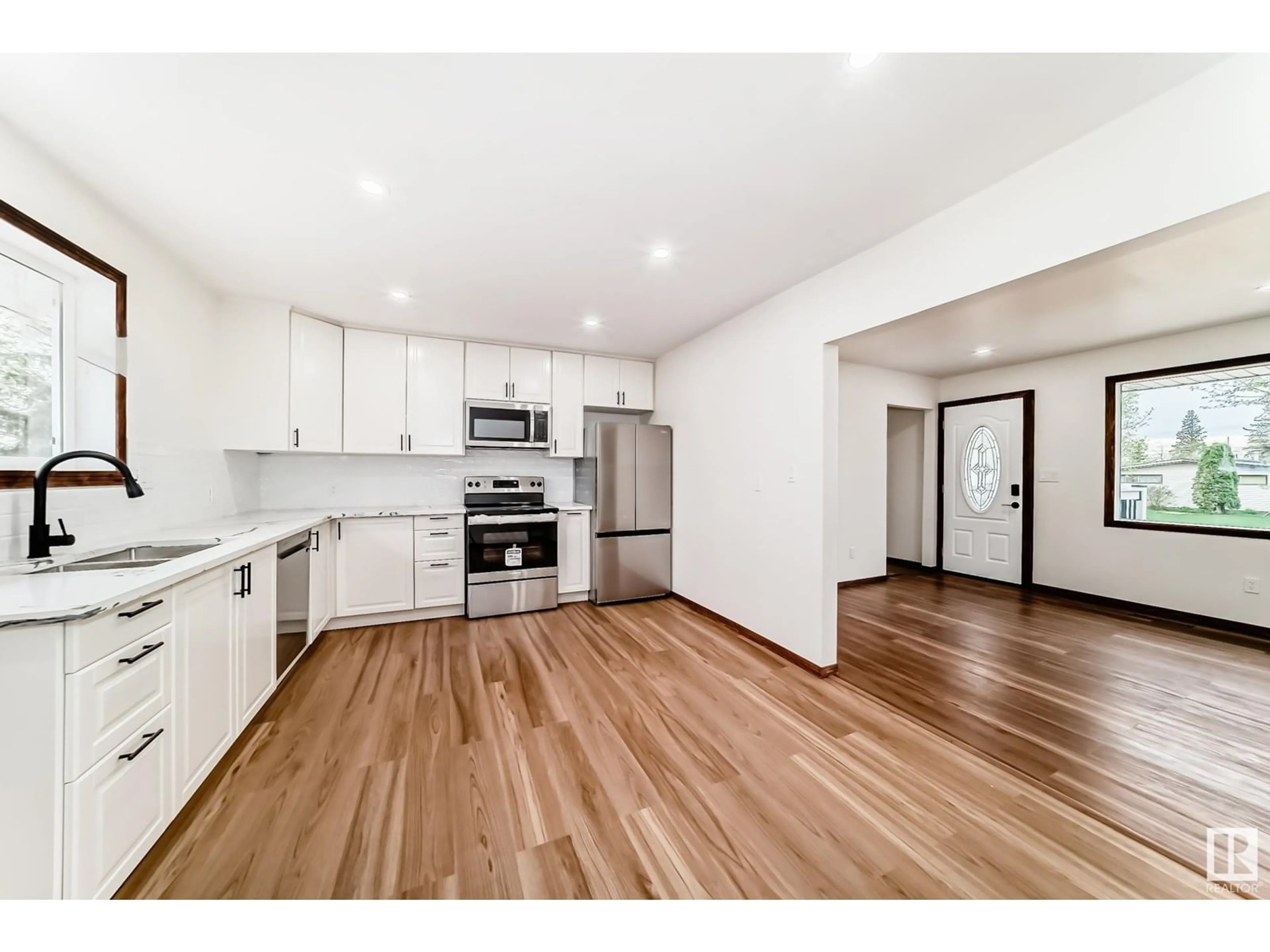 Open concept kitchen, wood/laminate floor for NW - 10961 157 ST, Edmonton Alberta T5P2W2