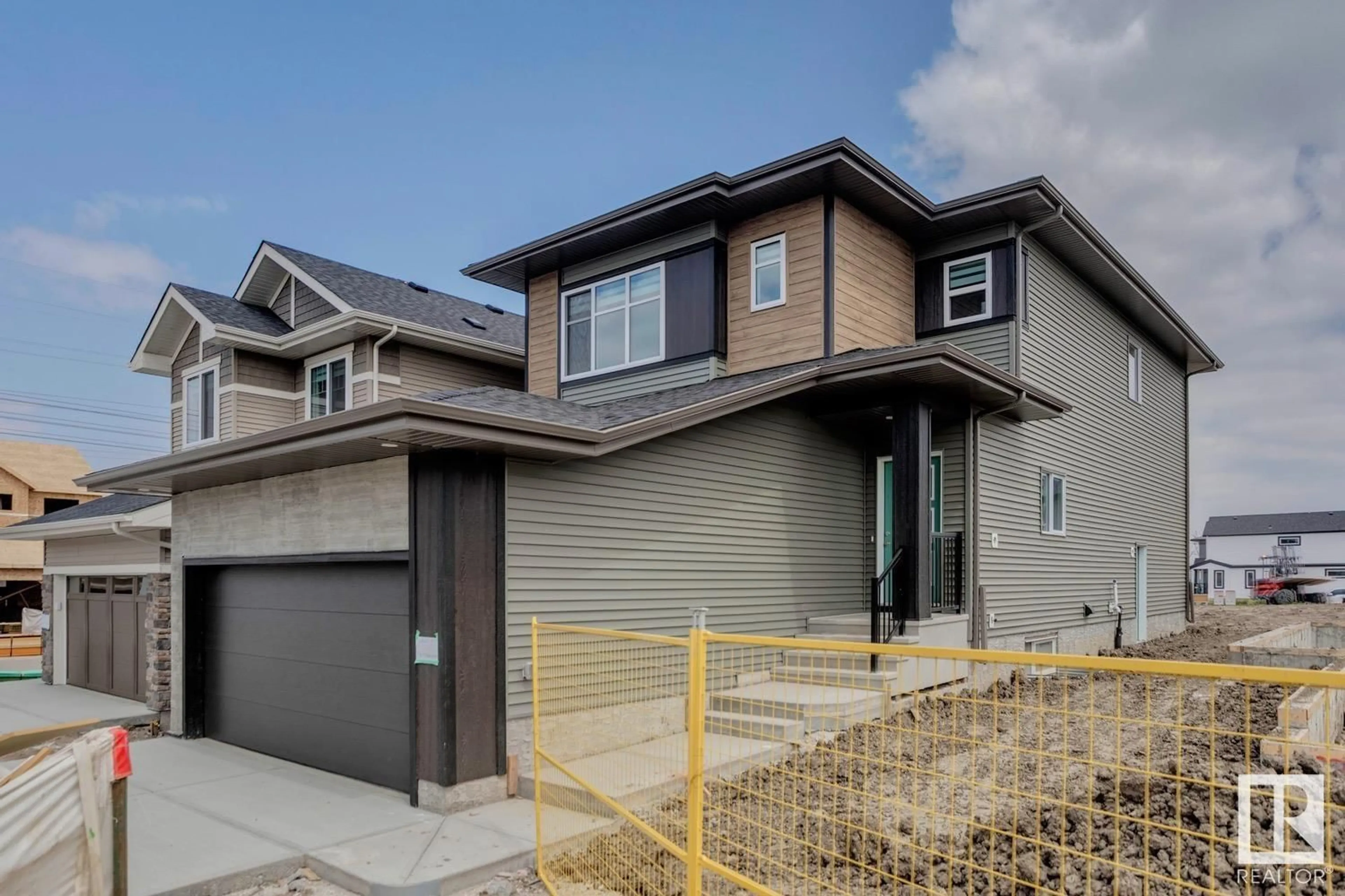 Home with vinyl exterior material, street for NW - 2827 191 ST, Edmonton Alberta T6M3C3