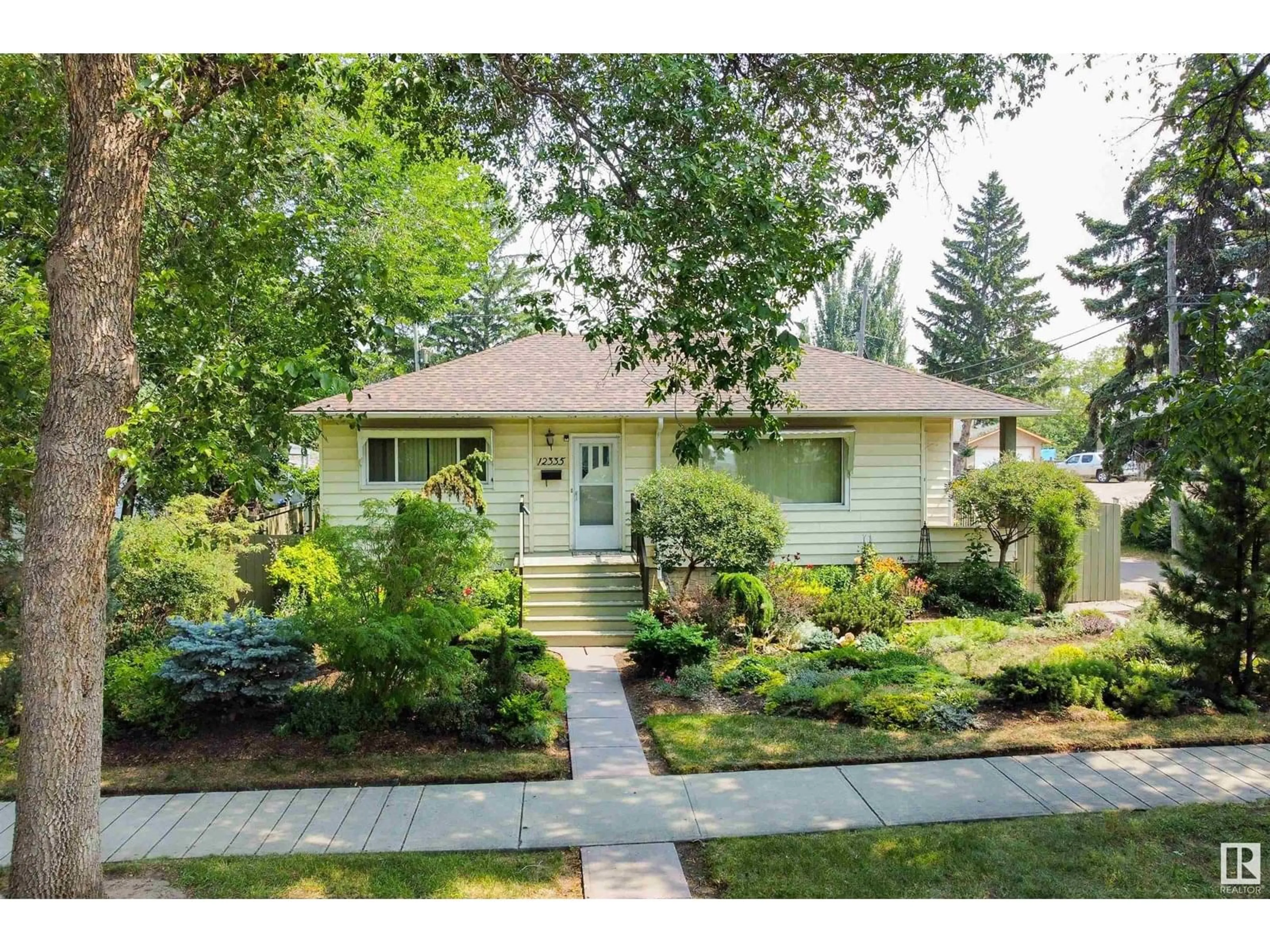 Home with vinyl exterior material, street for NW - 12335 131 ST, Edmonton Alberta T5L1N4