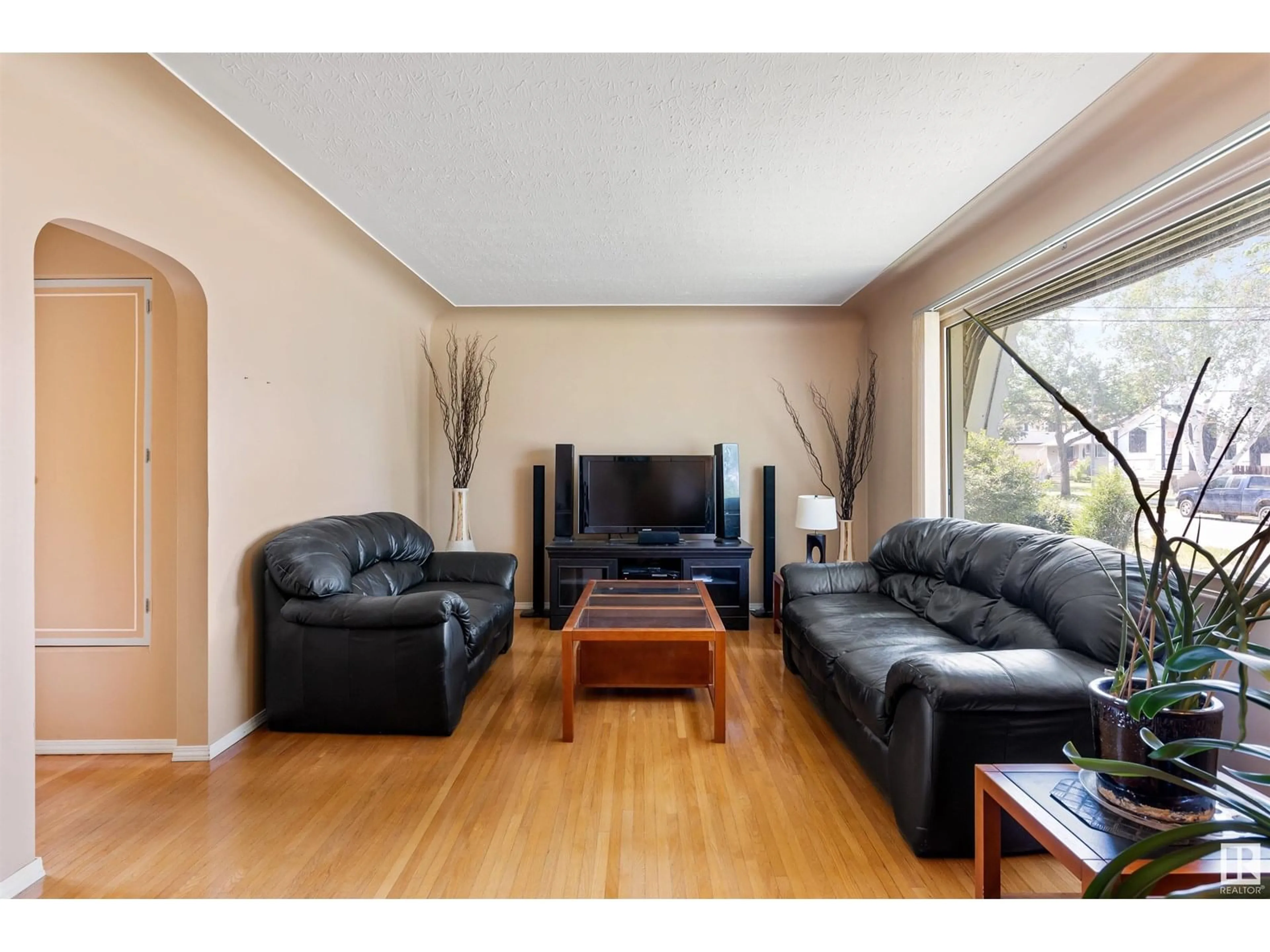 Living room with furniture, wood/laminate floor for NW - 12335 131 ST, Edmonton Alberta T5L1N4
